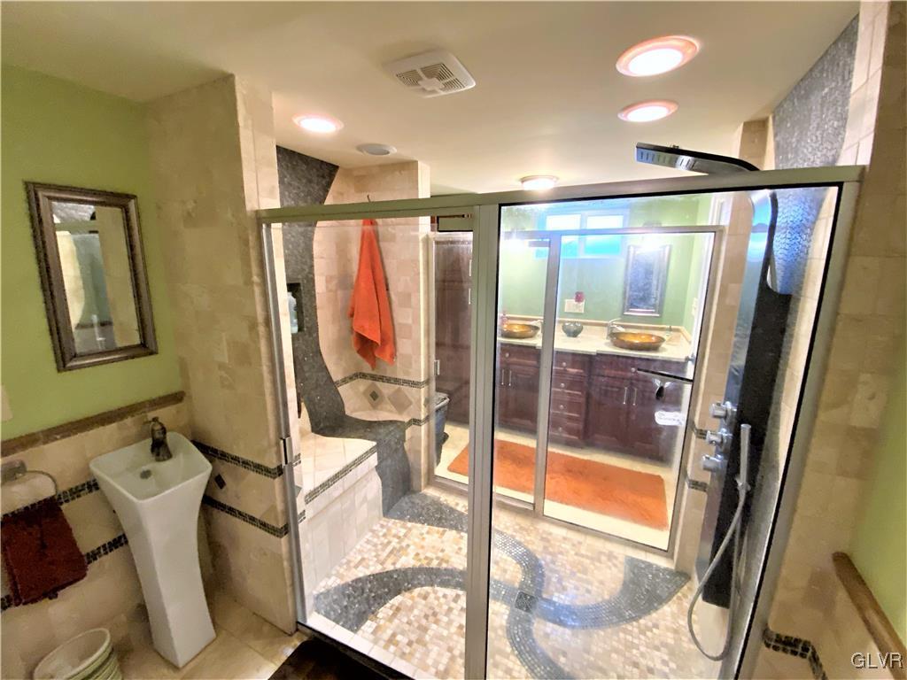 314 Willow Road Hellertown, PA 18055 - Photo 26 of 31 a bathroom with a glass door shower and sink
