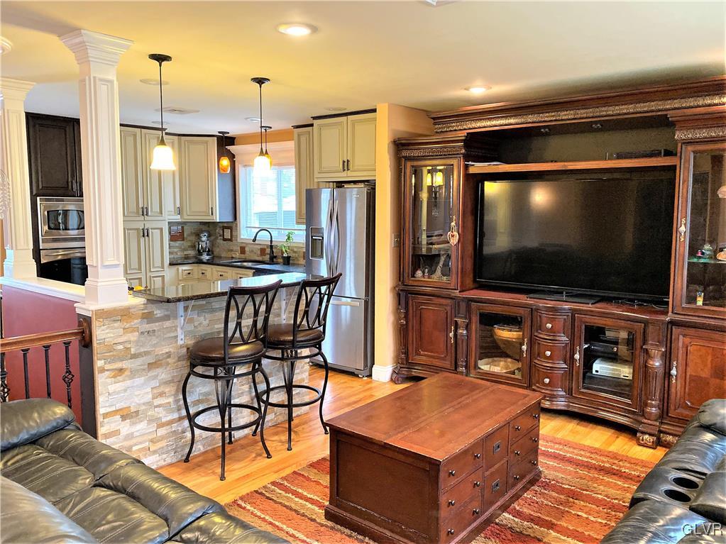 314 Willow Road Hellertown, PA 18055 - Photo 3 of 31 a living room with furniture and a flat screen tv