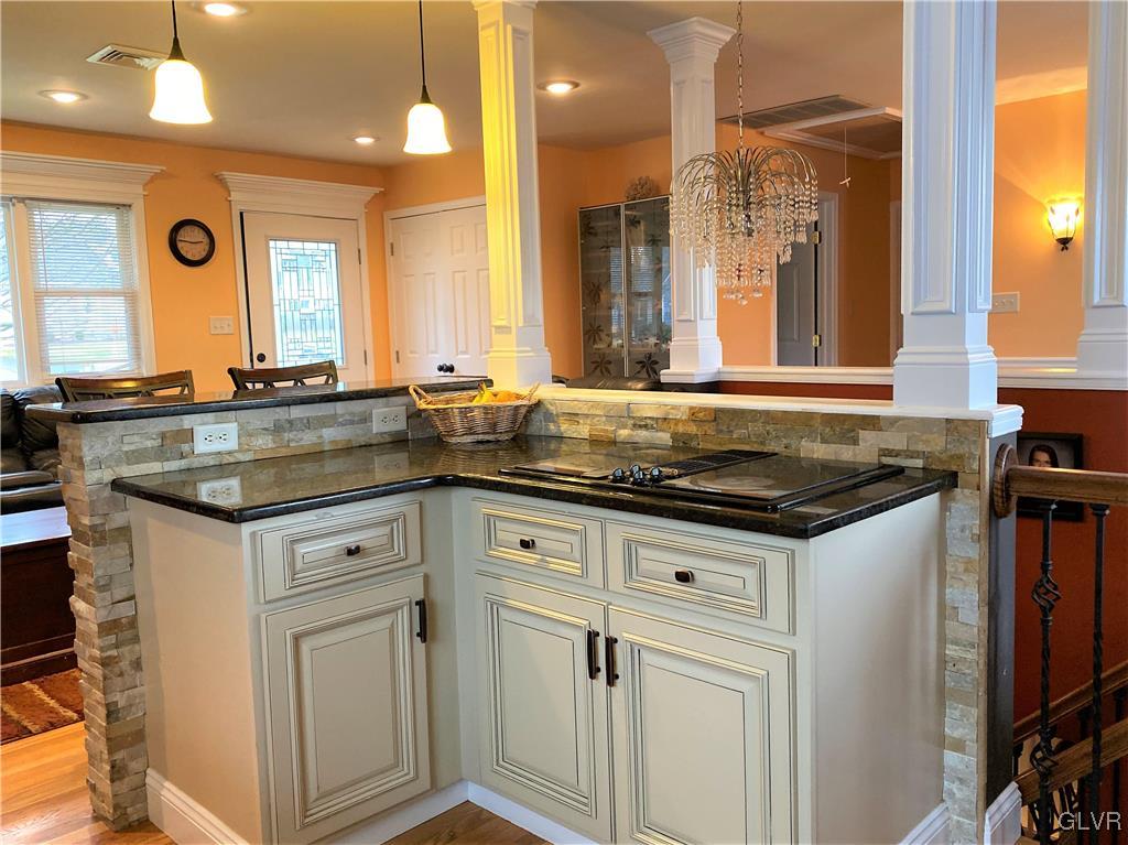 314 Willow Road Hellertown, PA 18055 - Photo 7 of 31 a kitchen with granite countertop a sink and cabinets