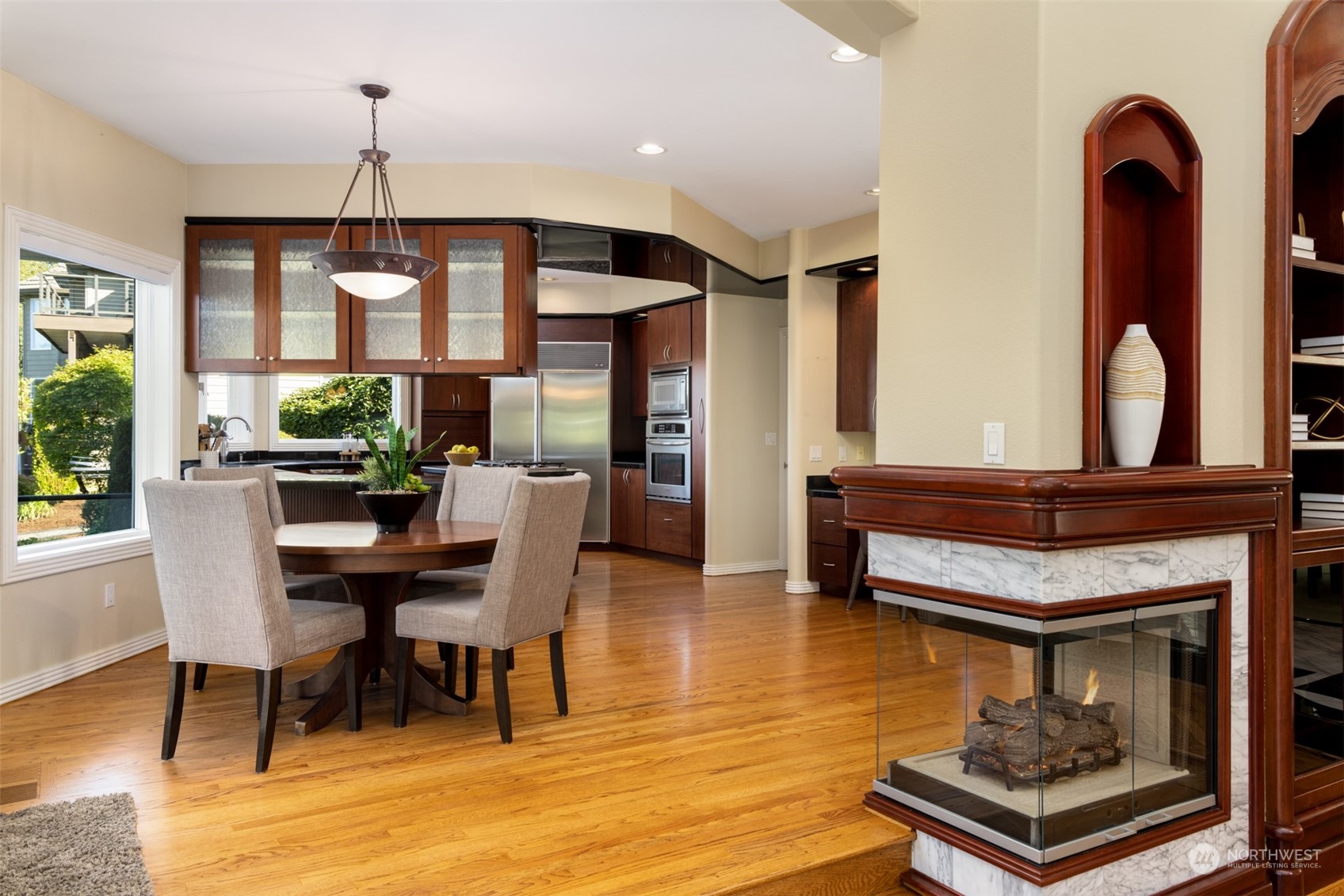 2013 Northwest Lacamas Drive Camas, WA 98607 - Photo 16 of 40 a dining room with wooden floor a chandelier a wooden table and chairs
