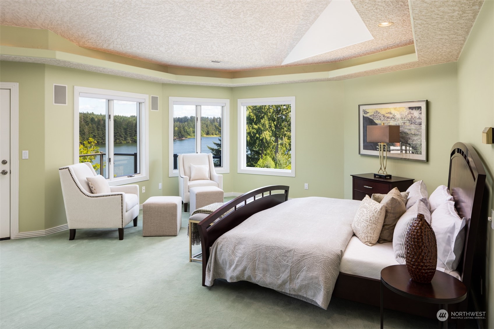 2013 Northwest Lacamas Drive Camas, WA 98607 - Photo 24 of 40 a bedroom with a bed and large windows