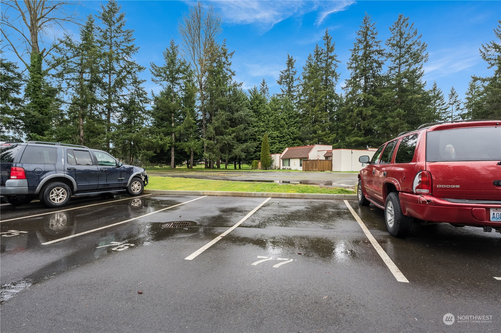 14600 Southeast 176th Street, Unit K8 Renton, WA 98058 - Photo 16 of 17 a view of a patio with a car parked