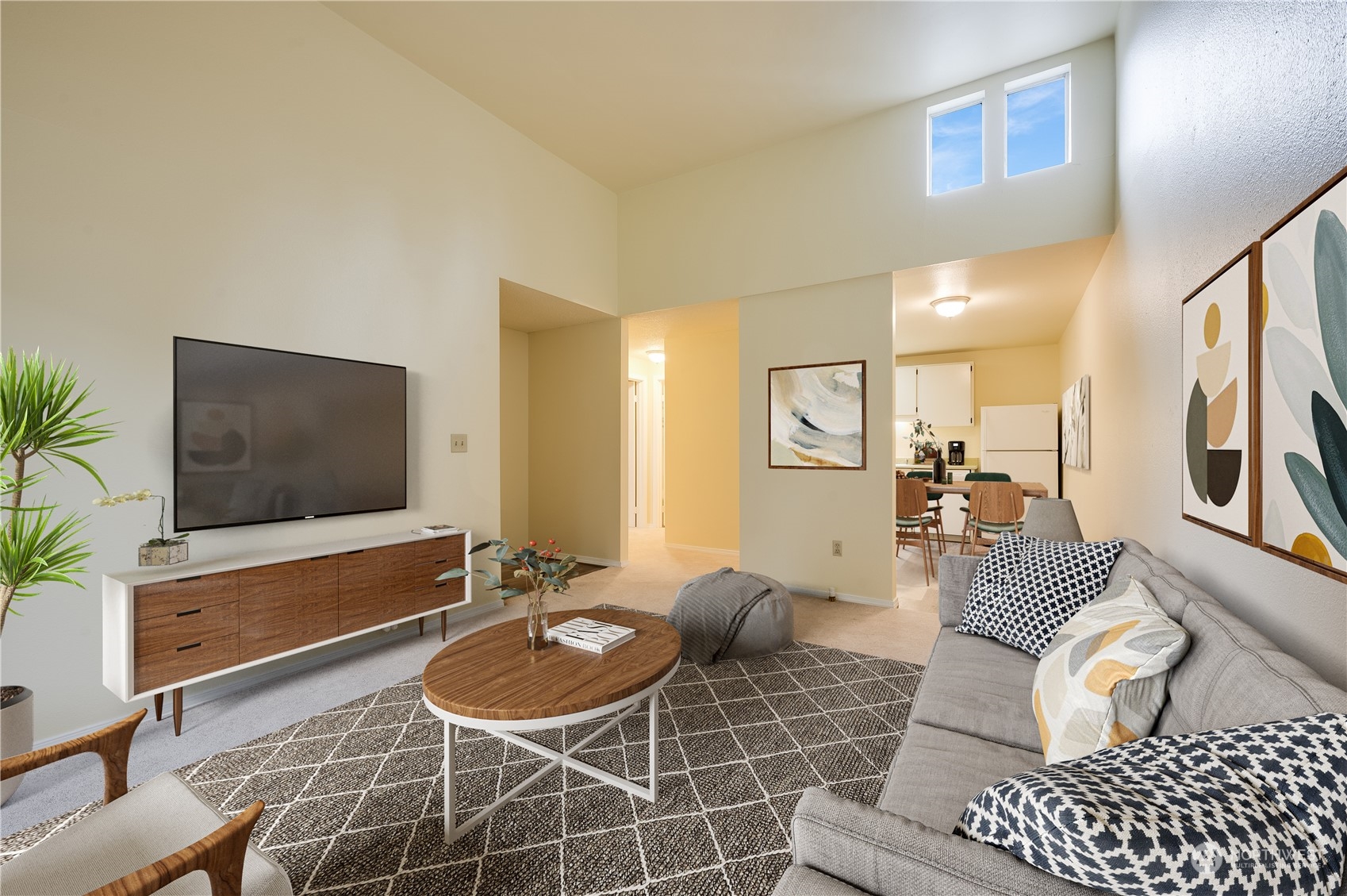 14600 Southeast 176th Street, Unit K8 Renton, WA 98058 - Photo 2 of 17 a living room with furniture and a flat screen tv