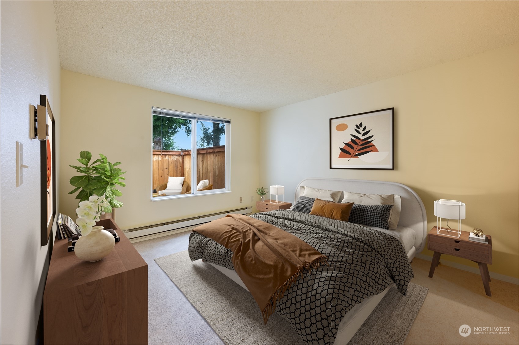 14600 Southeast 176th Street, Unit K8 Renton, WA 98058 - Photo 7 of 17 a bedroom with a bed and a painting on the wall