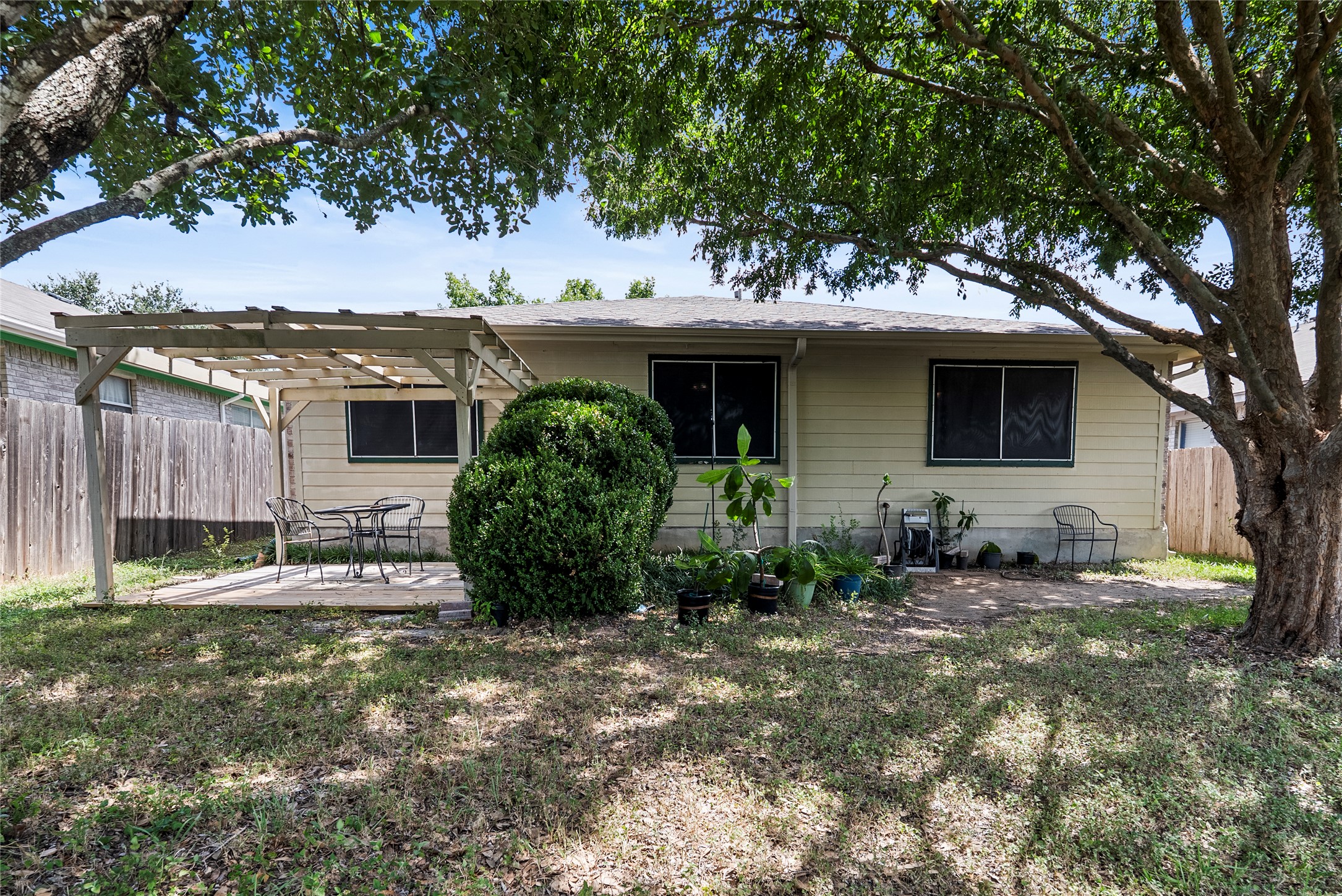 120 Shenandoah Trail Elgin, TX 78621 - Photo 14 of 16 Rear view of house with a patio and a pergola