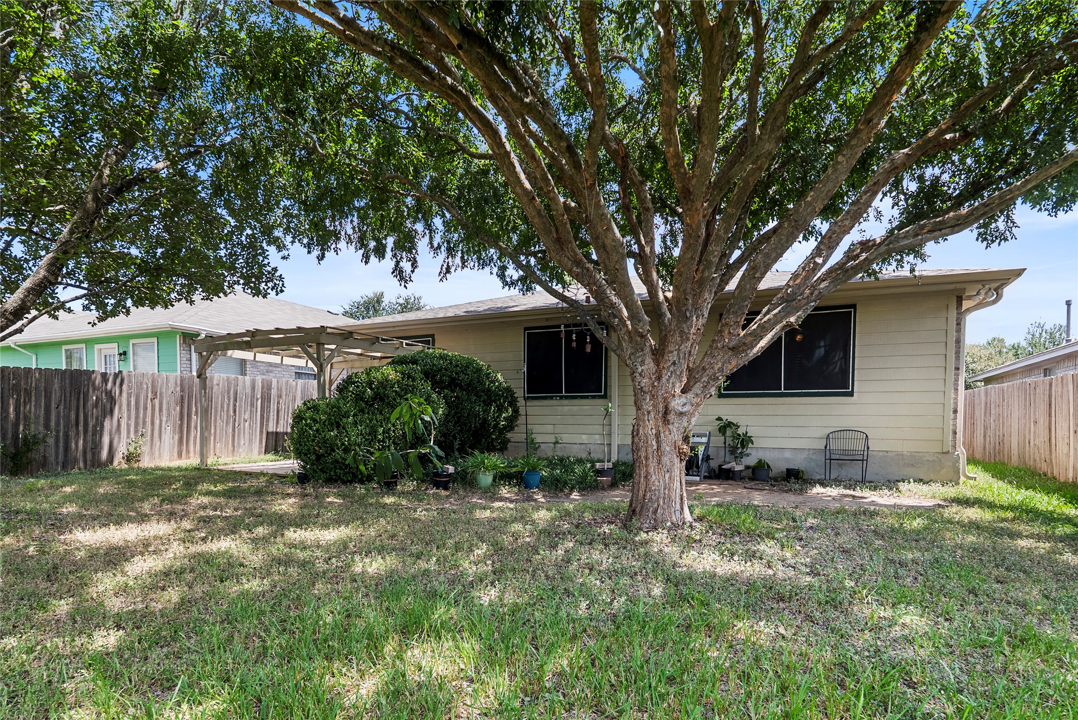 120 Shenandoah Trail Elgin, TX 78621 - Photo 15 of 16 Rear view of house with a patio and a pergola