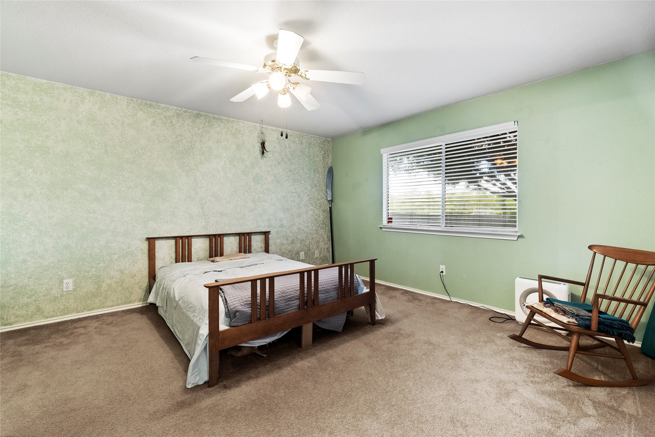 120 Shenandoah Trail Elgin, TX 78621 - Photo 8 of 16 Carpeted bedroom featuring a ceiling fan