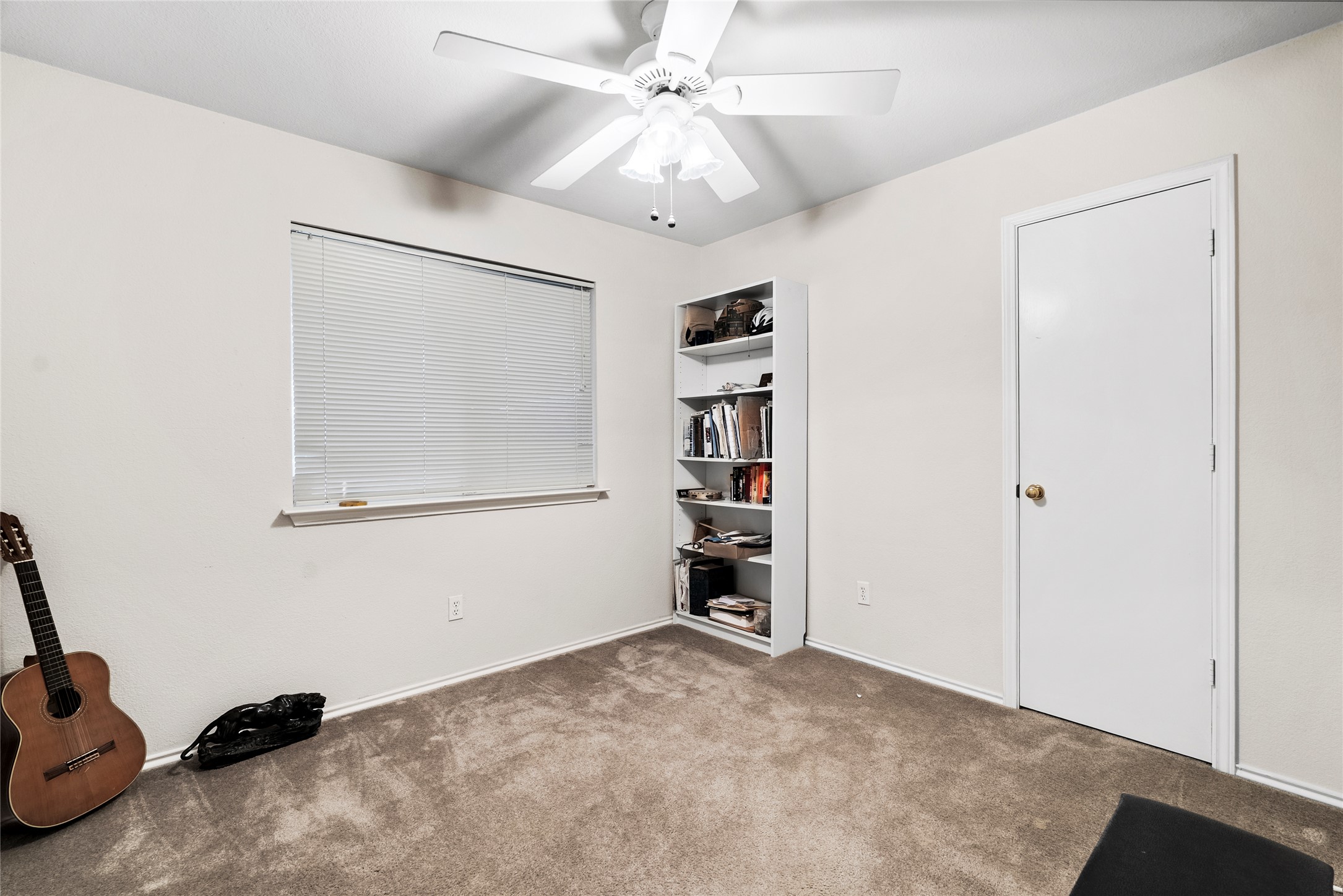 120 Shenandoah Trail Elgin, TX 78621 - Photo 10 of 16 Bedroom with carpet and ceiling fan