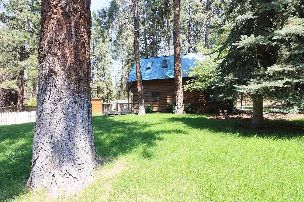 60448 Zuni Road Bend, OR 97702 - Photo 26 of 27 View of house from corner of backyard...
