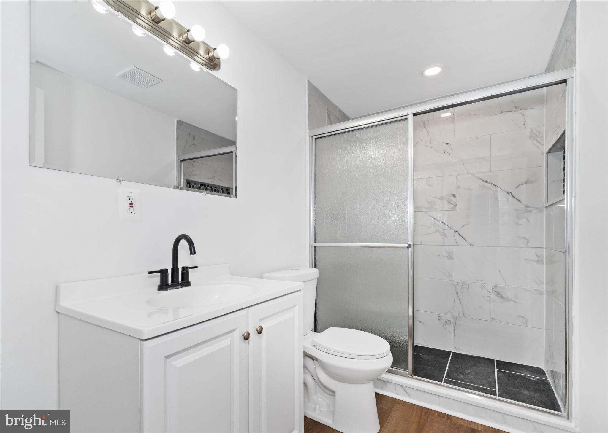214 Keiser Place New Castle, DE 19720 - Photo 12 of 23 a bathroom with a sink mirror vanity and toilet