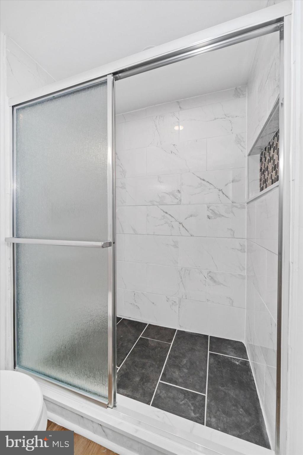 214 Keiser Place New Castle, DE 19720 - Photo 13 of 23 a bathroom with a glass shower door