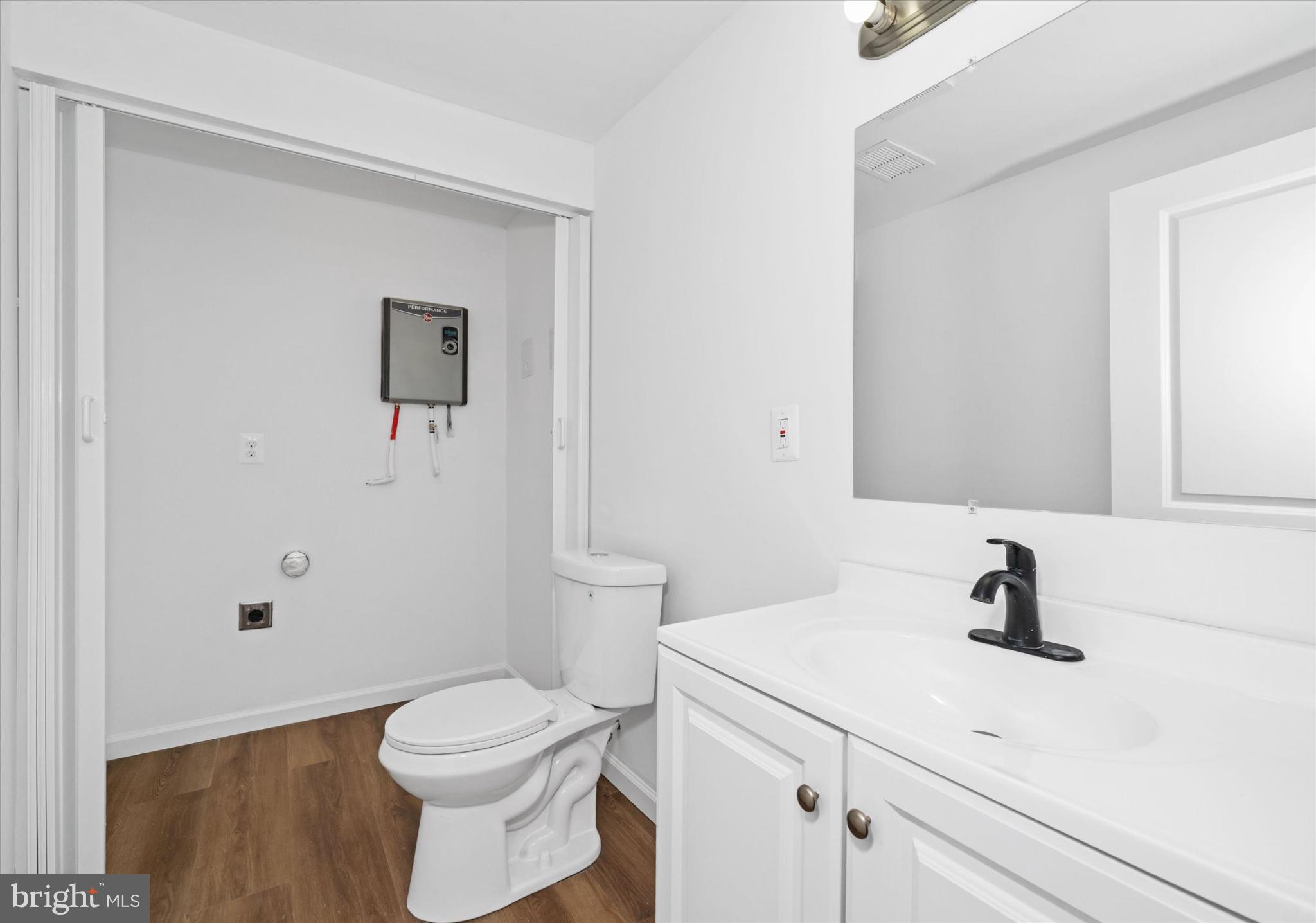 214 Keiser Place New Castle, DE 19720 - Photo 14 of 23 a bathroom with a sink a toilet and a mirror