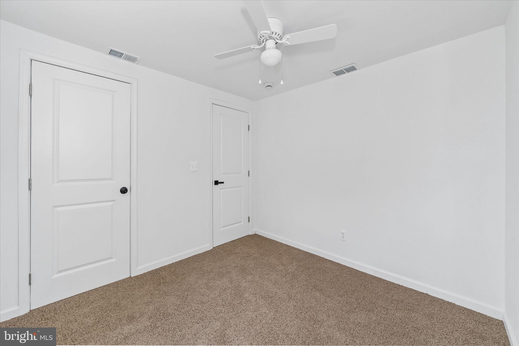 214 Keiser Place New Castle, DE 19720 - Photo 16 of 23 an empty room with a ceiling fan and a window