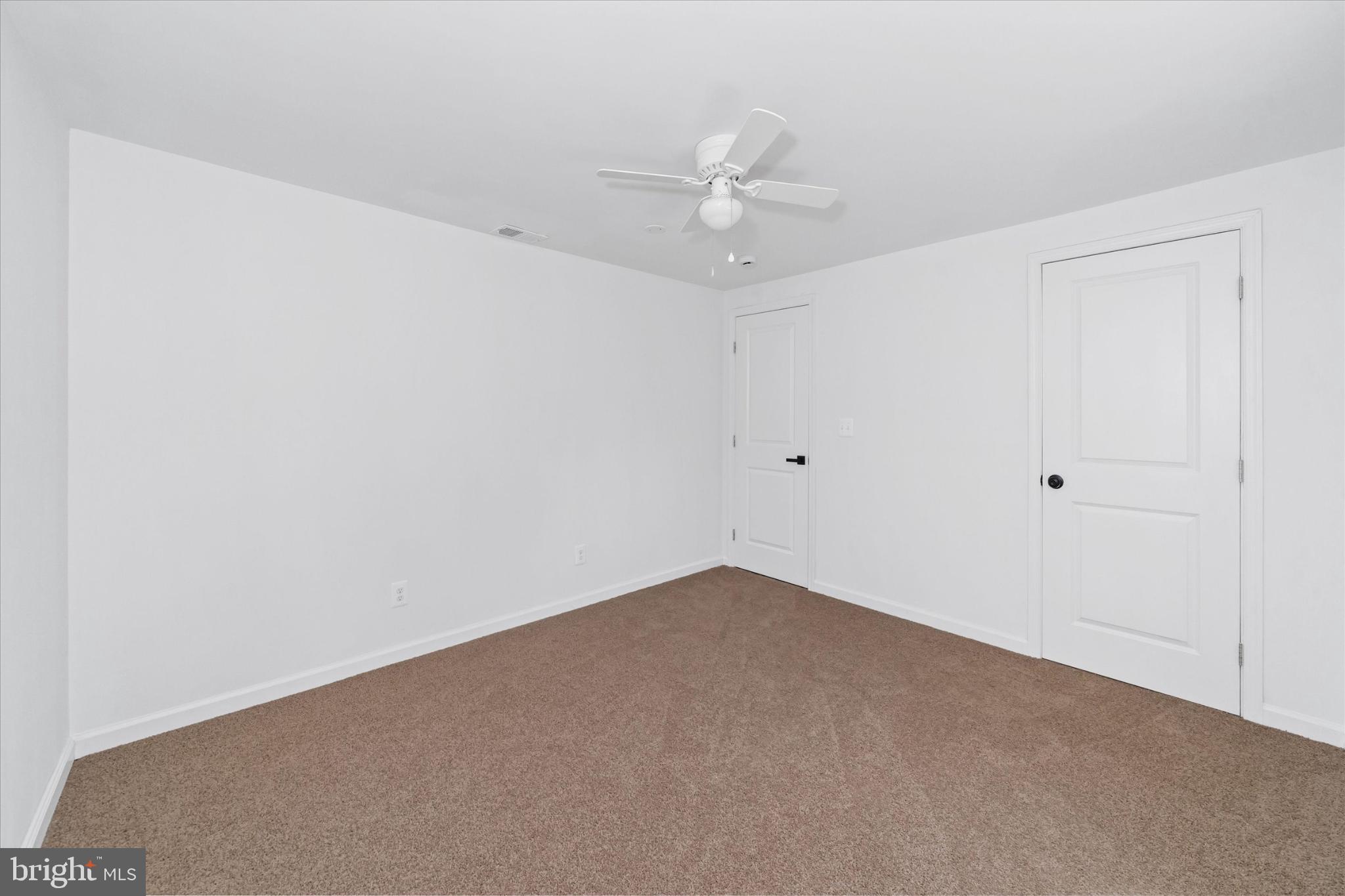 214 Keiser Place New Castle, DE 19720 - Photo 18 of 23 an empty room with a window and a fan