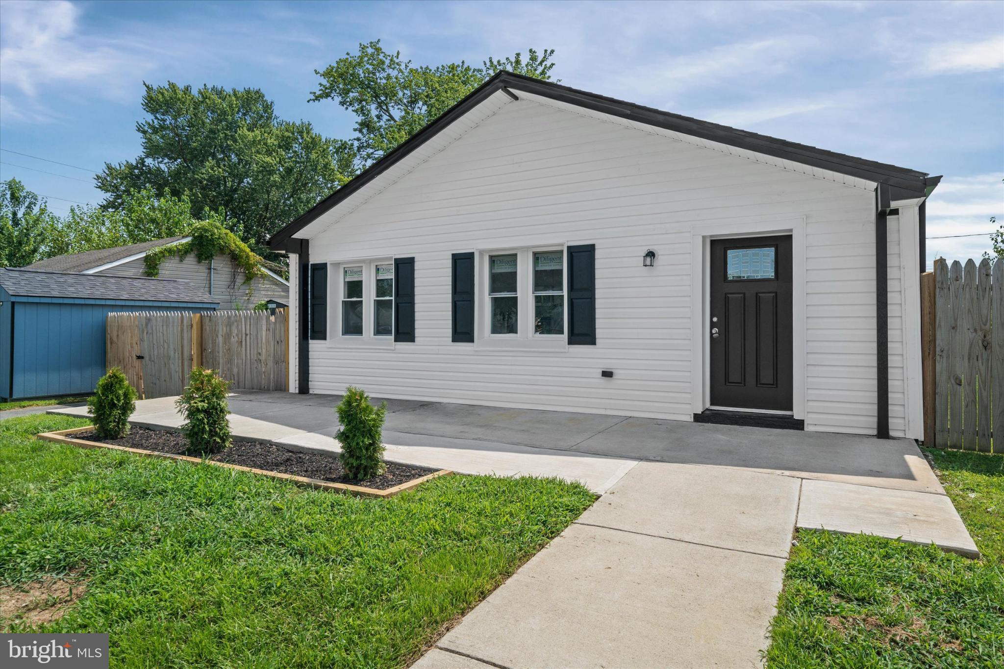 214 Keiser Place New Castle, DE 19720 - Photo 2 of 23 a front view of a house with garden