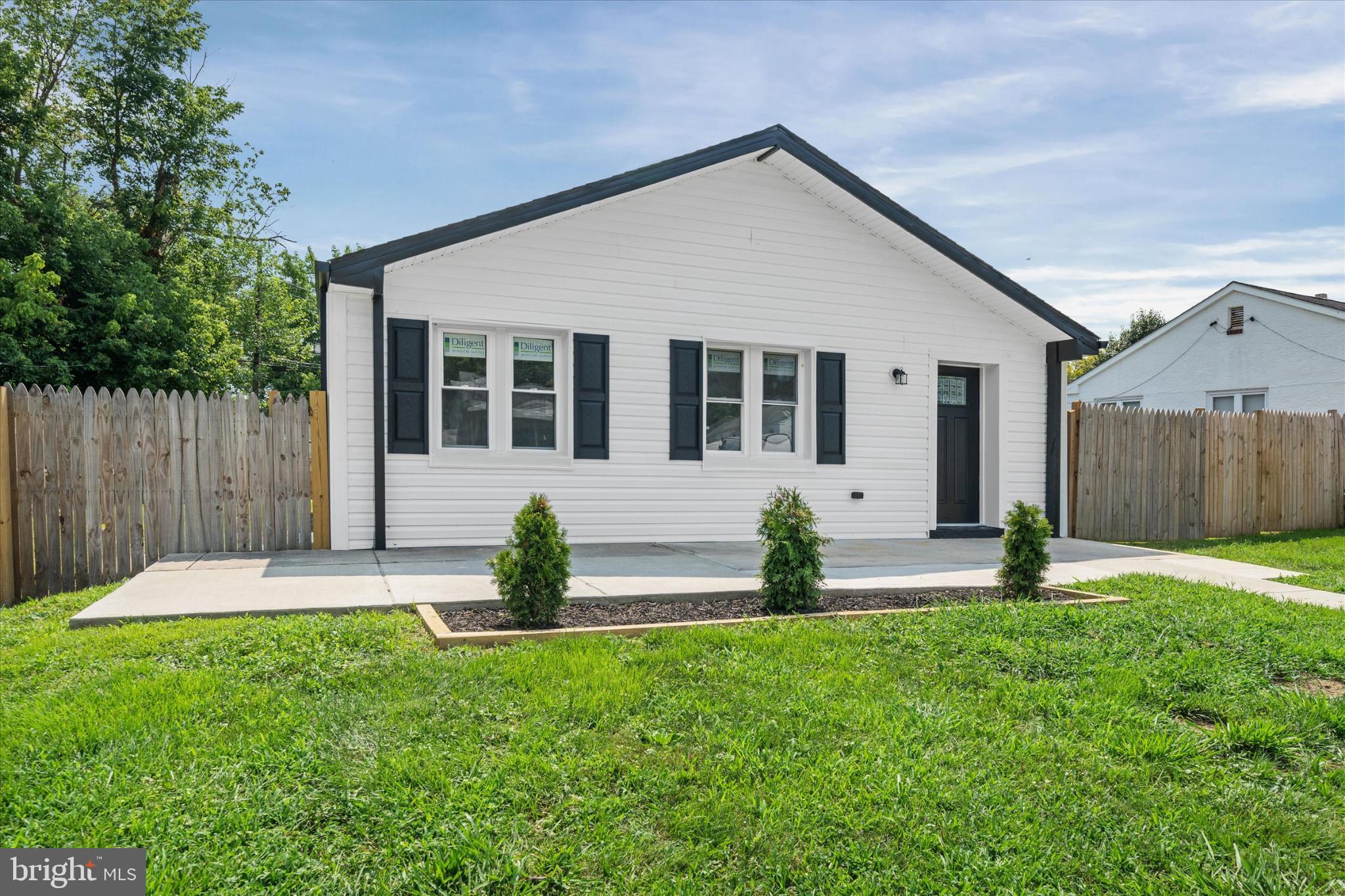 214 Keiser Place New Castle, DE 19720 - Photo 3 of 23 front view of a house with a yard
