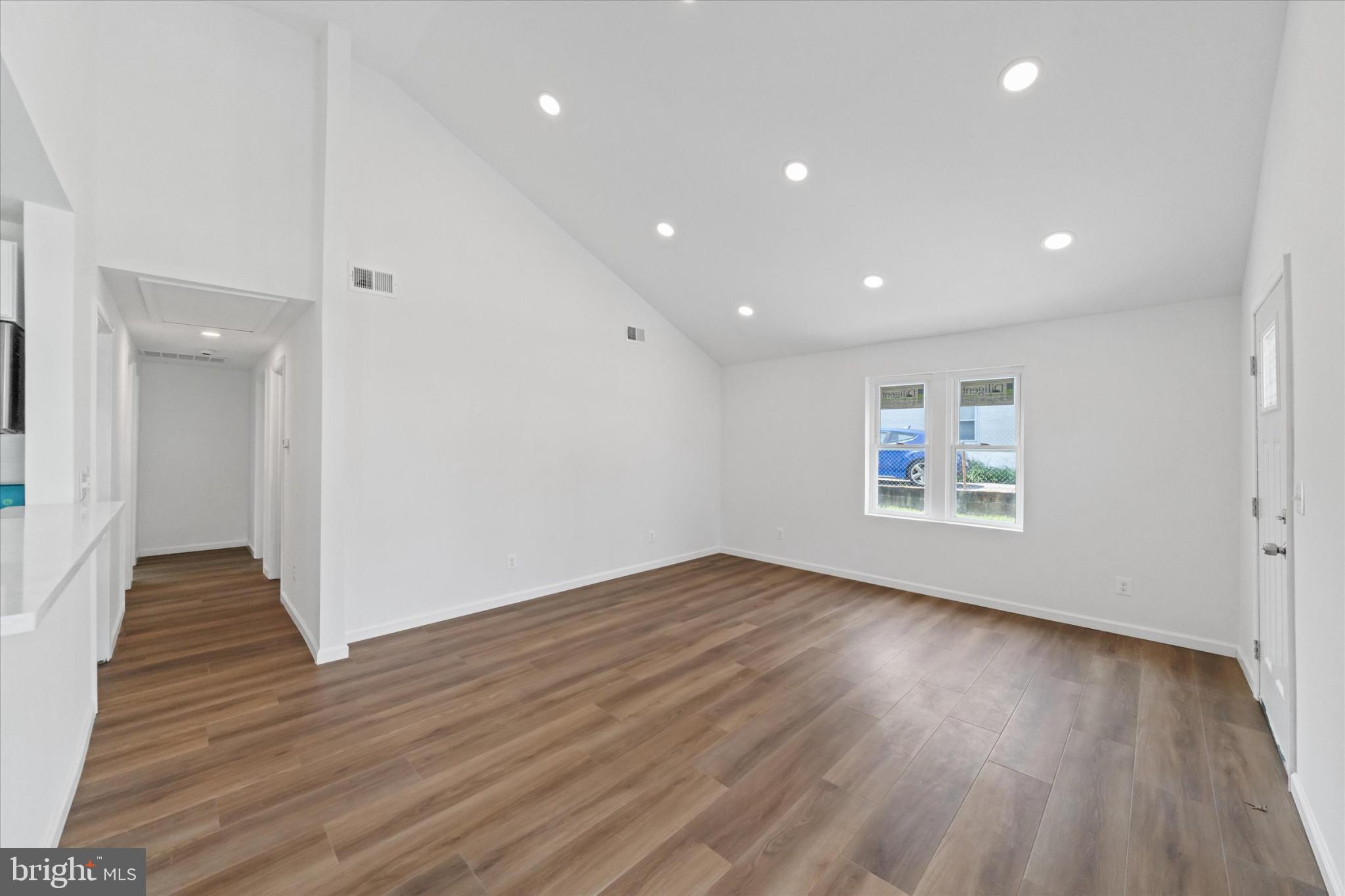 214 Keiser Place New Castle, DE 19720 - Photo 5 of 23 a view of an empty room with wooden floor and a window