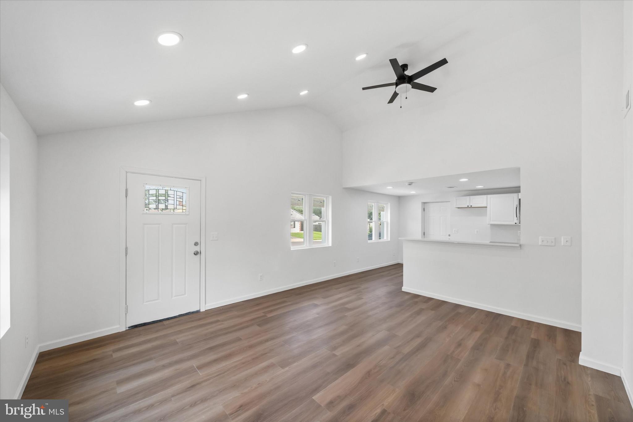 214 Keiser Place New Castle, DE 19720 - Photo 6 of 23 an empty room with wooden floor and windows