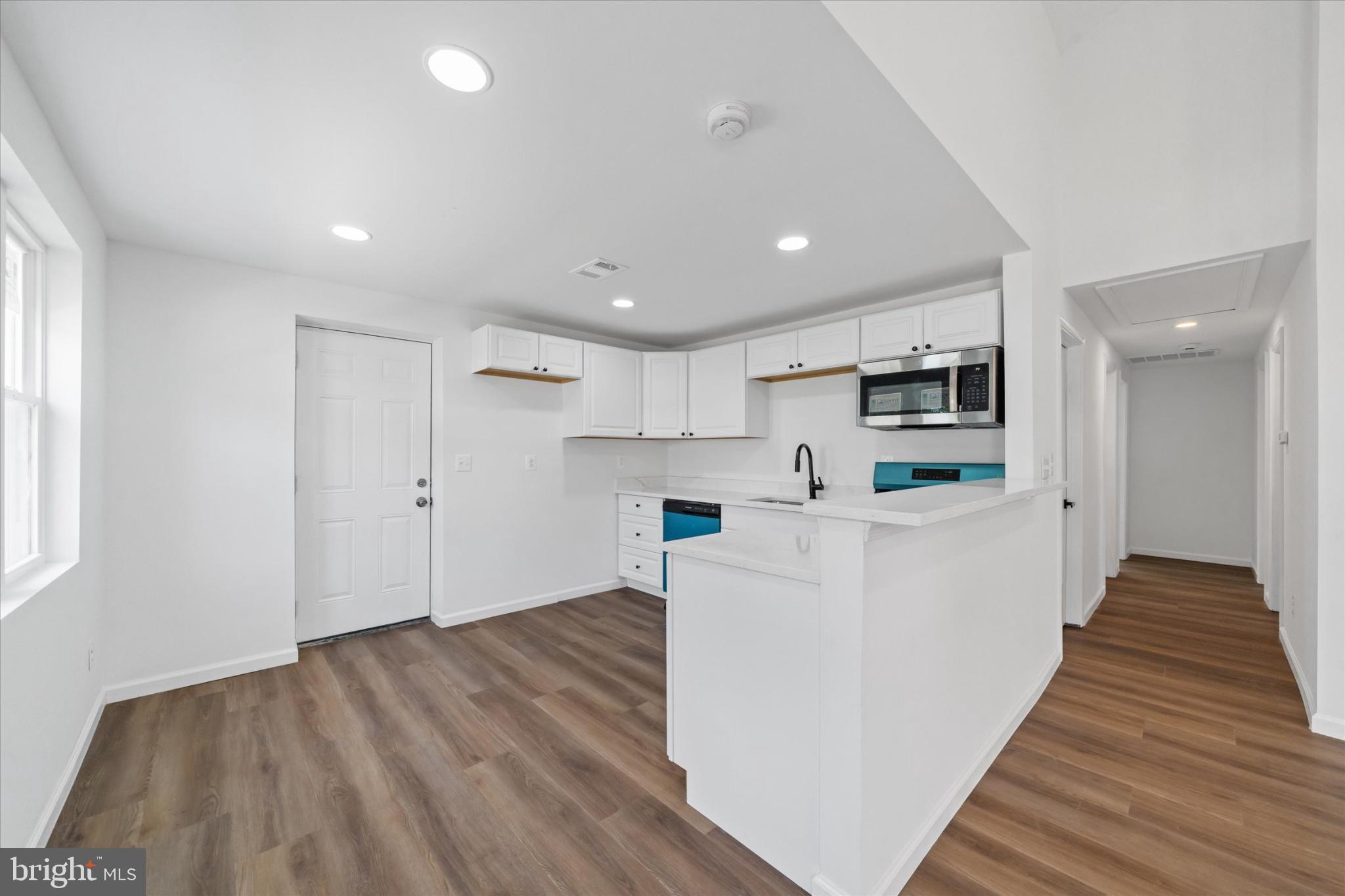 214 Keiser Place New Castle, DE 19720 - Photo 10 of 23 a view of kitchen with wooden floor and electronic appliances