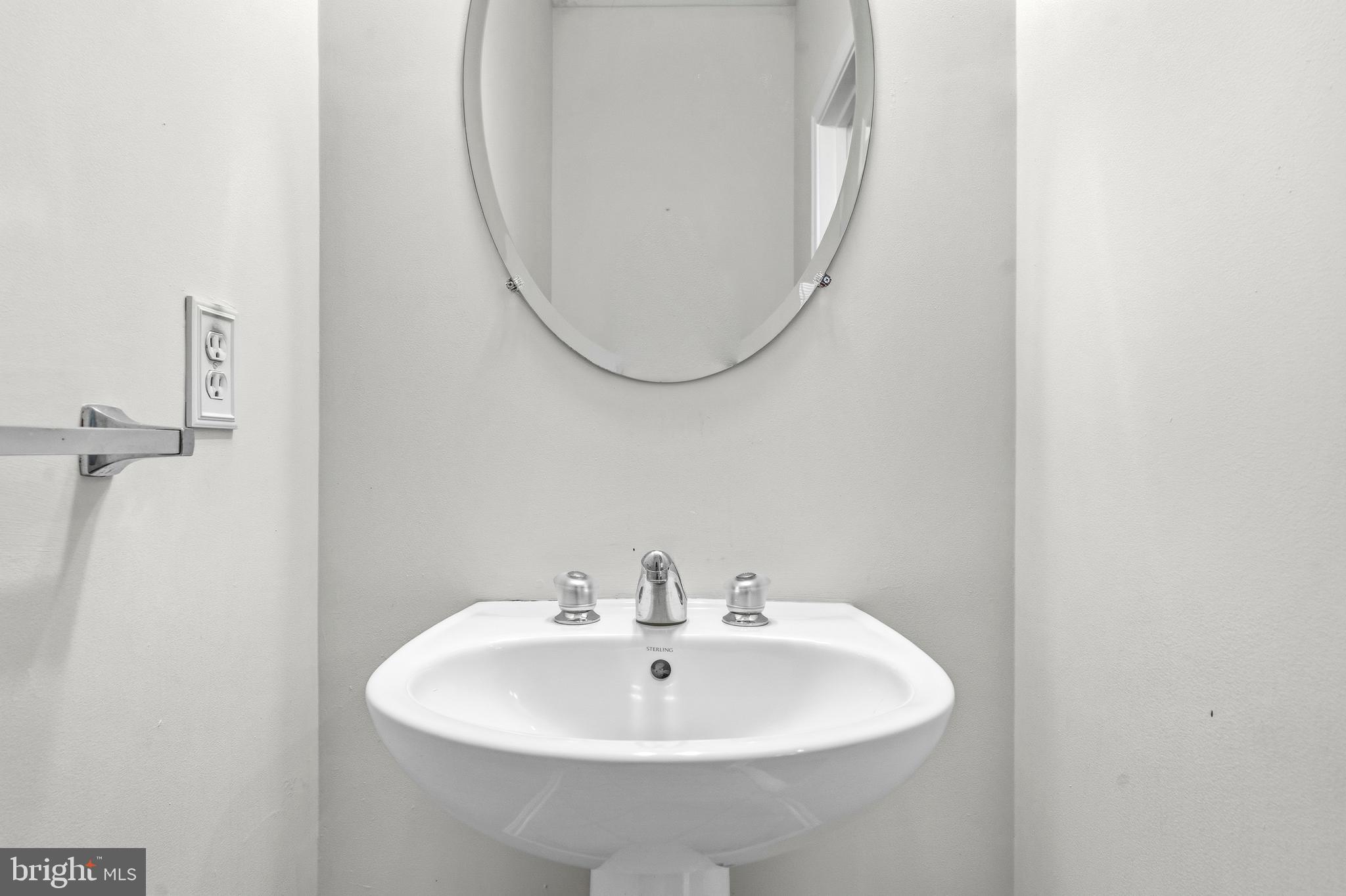 25154 Monteith Terrace Chantilly, VA 20152 - Photo 13 of 40 a bathroom with a sink and a mirror