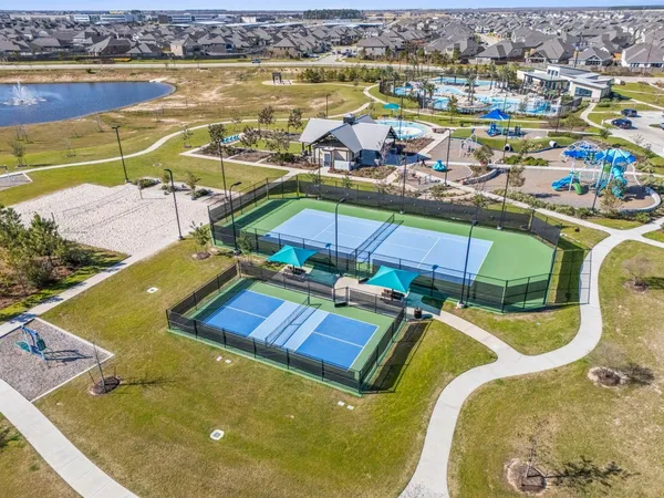 an aerial view of residential houses with outdoor space