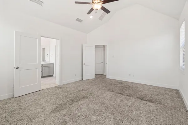 a bathroom with a double vanity sink a mirror and a bathtub