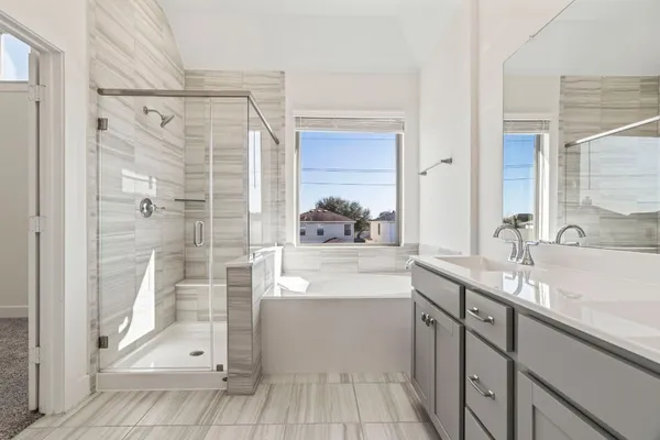 a bathroom with a glass shower door