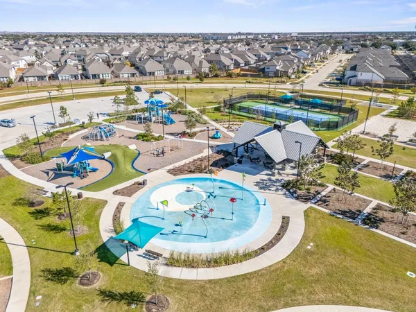 a view of a swimming pool with outdoor seating