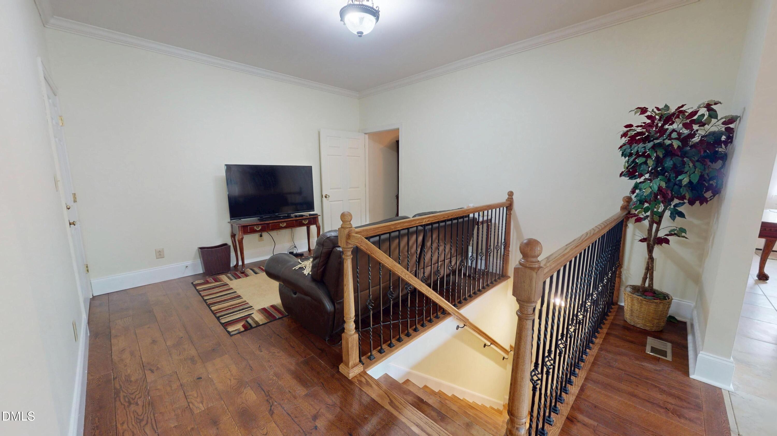 238 North Main Street Wake Forest, NC 27587 - Photo 13 of 100 a view of entryway and hall with wooden floor