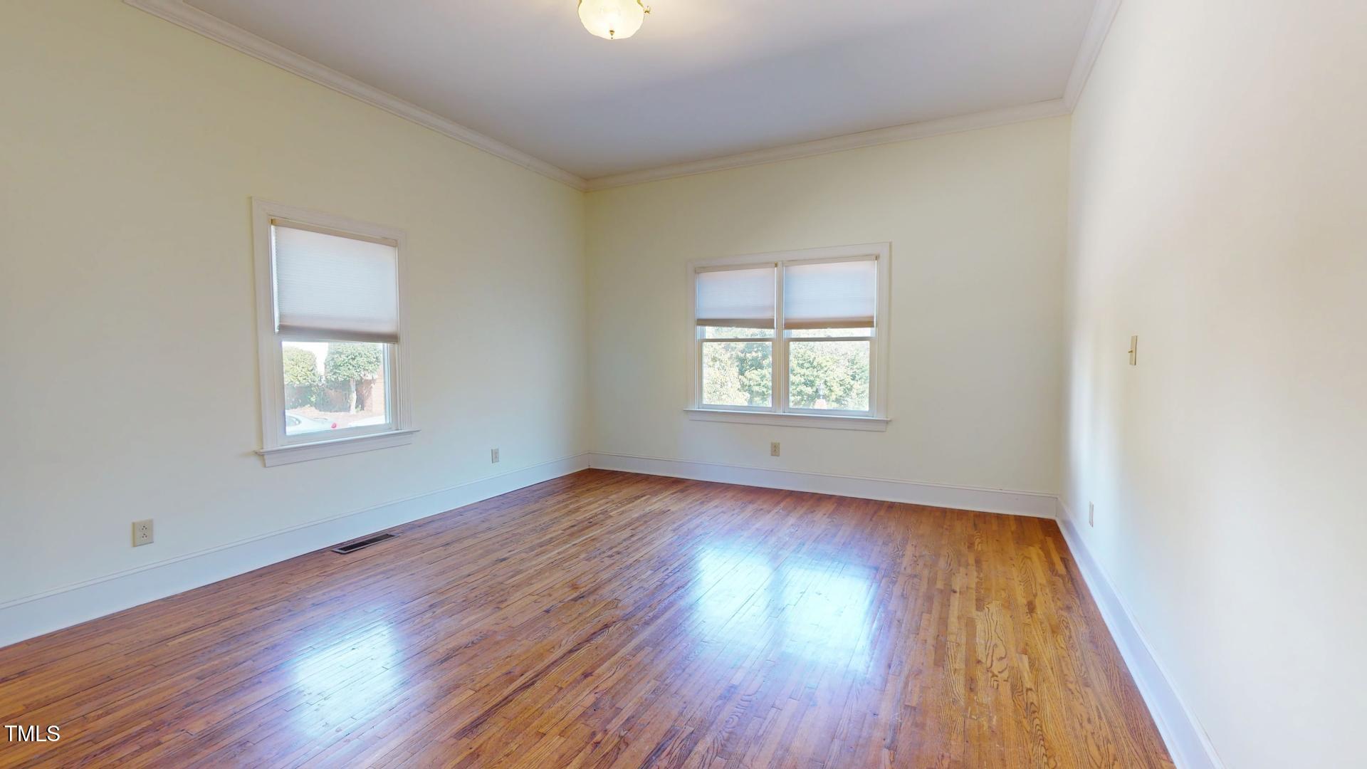 238 North Main Street Wake Forest, NC 27587 - Photo 29 of 100 an empty room with wooden floor and windows
