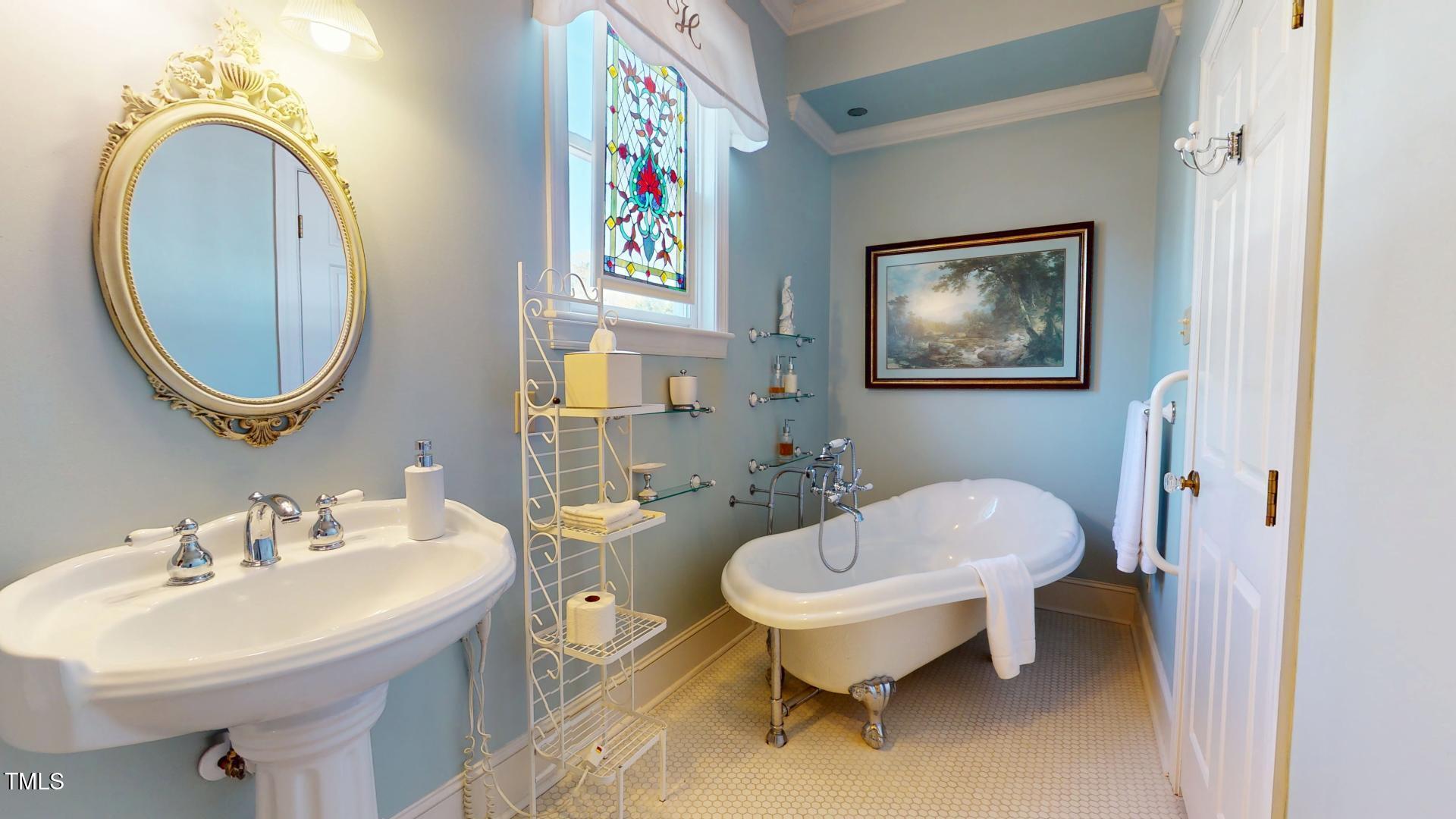 238 North Main Street Wake Forest, NC 27587 - Photo 34 of 100 a bathroom with a toilet a sink and a mirror