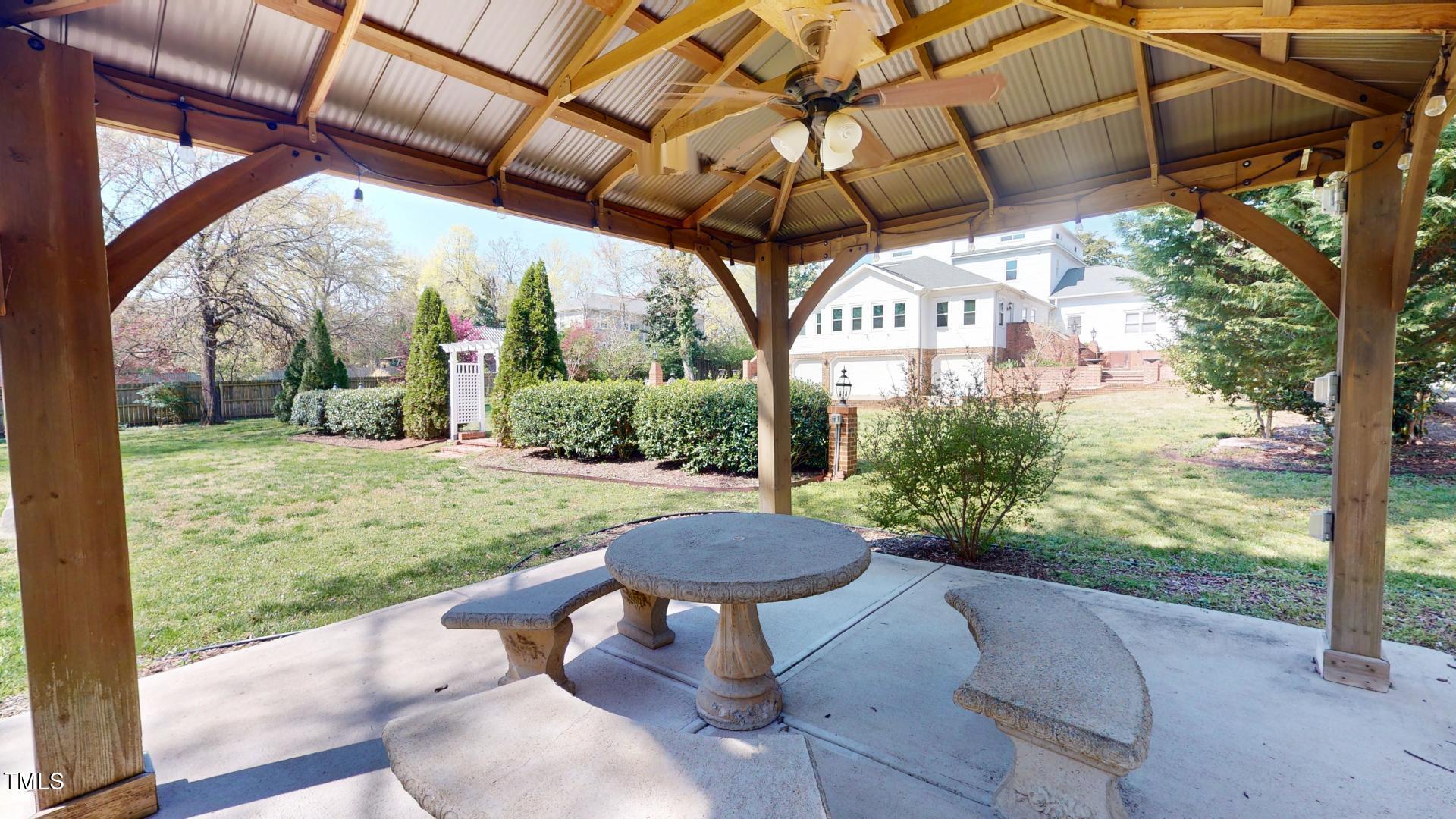 238 North Main Street Wake Forest, NC 27587 - Photo 50 of 100 a view of a porch with furniture and a yard