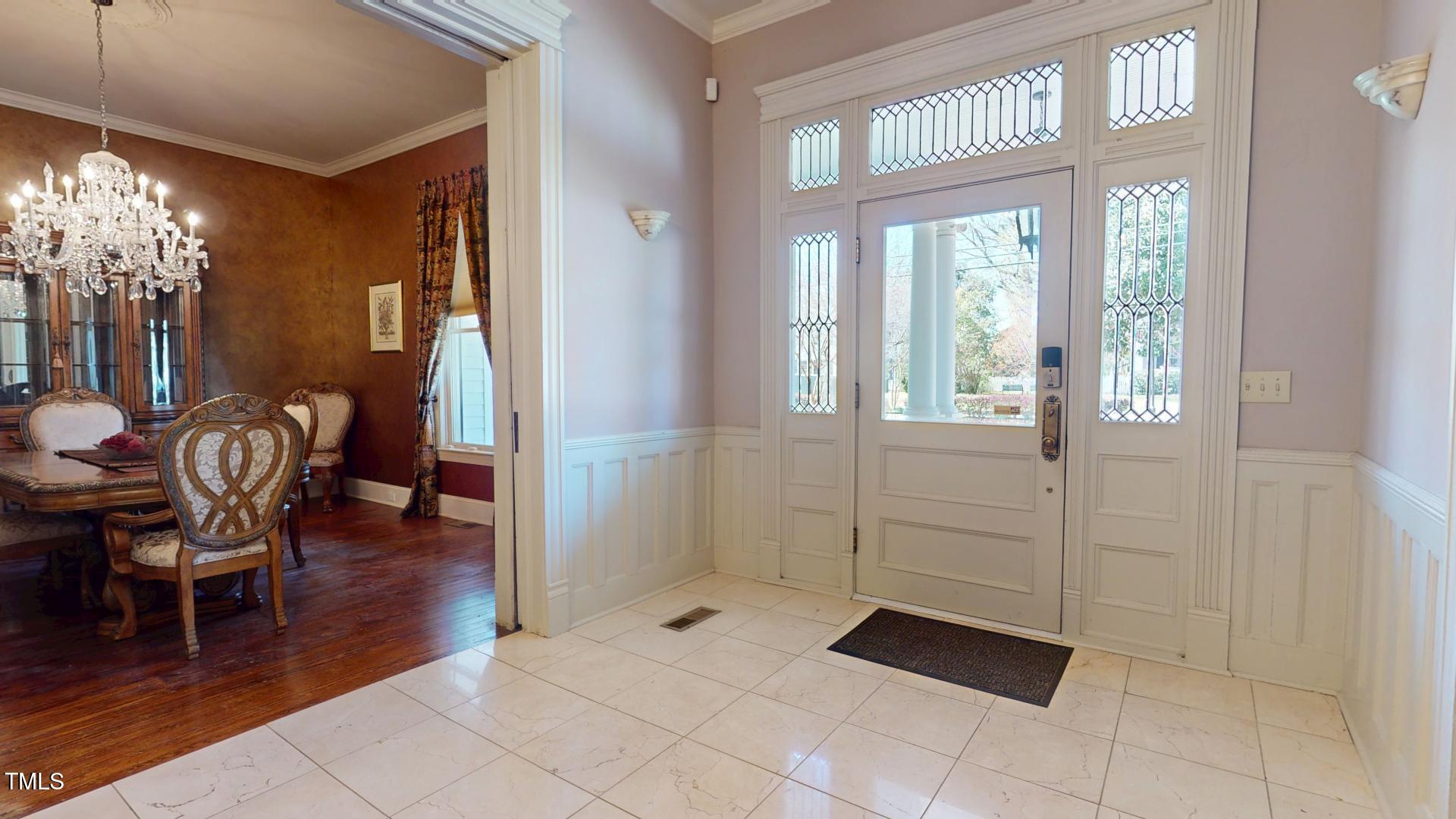238 North Main Street Wake Forest, NC 27587 - Photo 56 of 100 a view of a livingroom with furniture wooden floor and chandelier