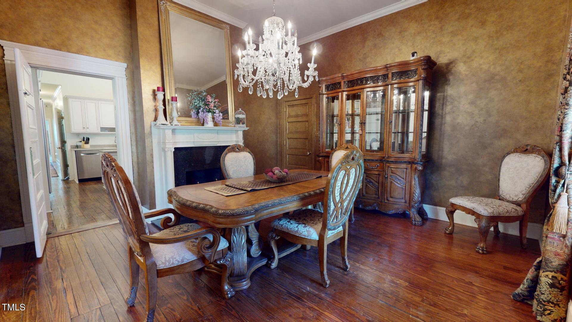 238 North Main Street Wake Forest, NC 27587 - Photo 6 of 100 a view of a dining room with furniture a chandelier and wooden floor