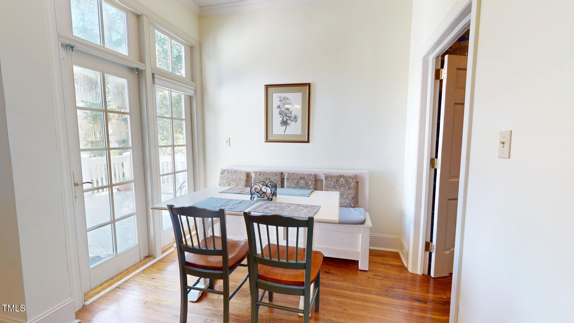 238 North Main Street Wake Forest, NC 27587 - Photo 61 of 100 a view of a dining room with furniture and wooden floor