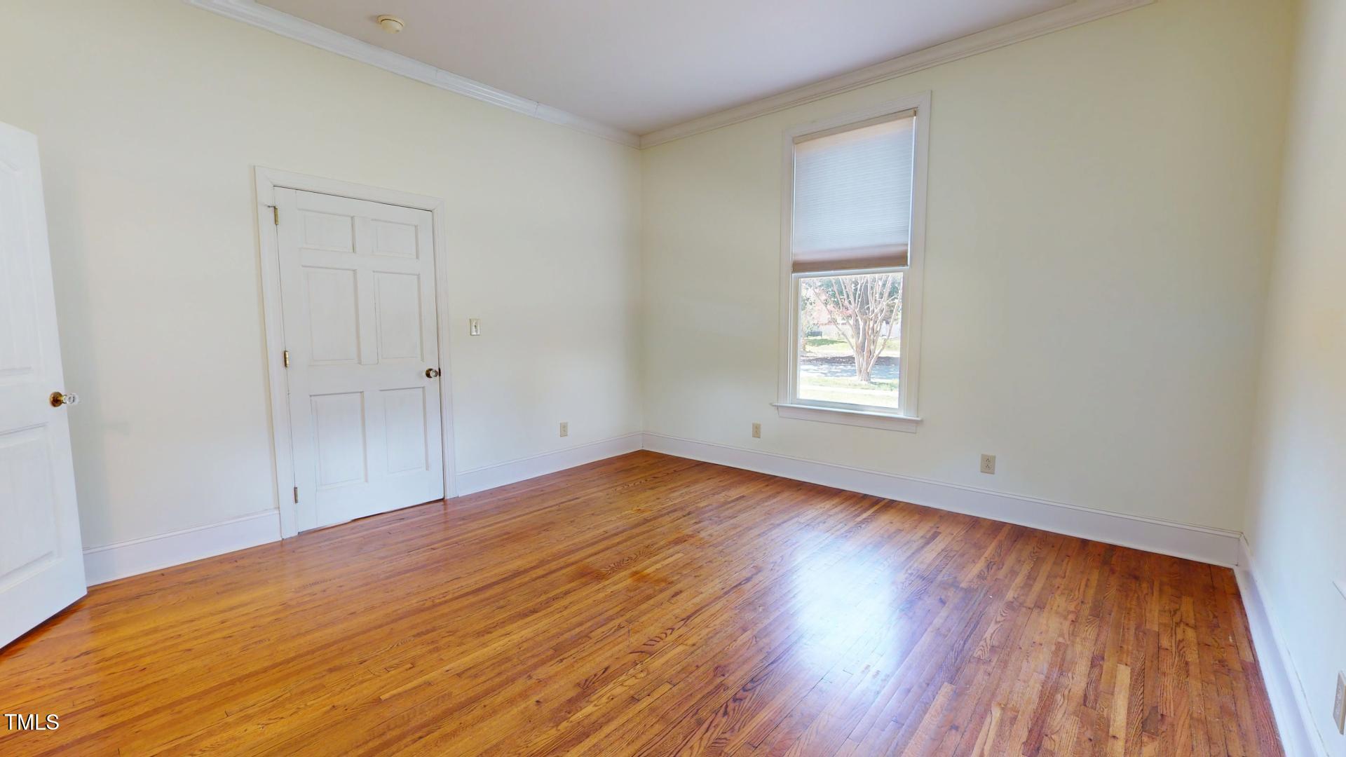 238 North Main Street Wake Forest, NC 27587 - Photo 71 of 100 a view of empty room with wooden floor and fan