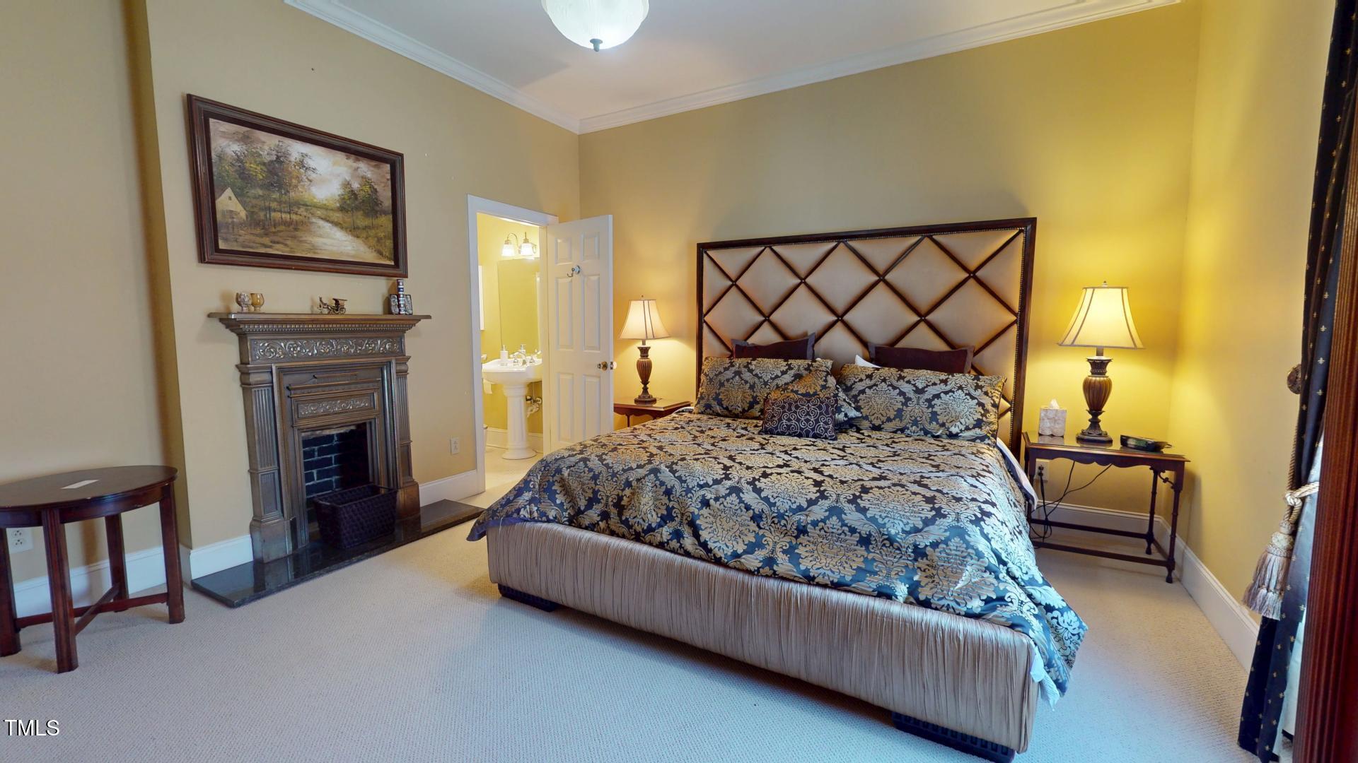238 North Main Street Wake Forest, NC 27587 - Photo 77 of 100 a bedroom with a bed and a couch