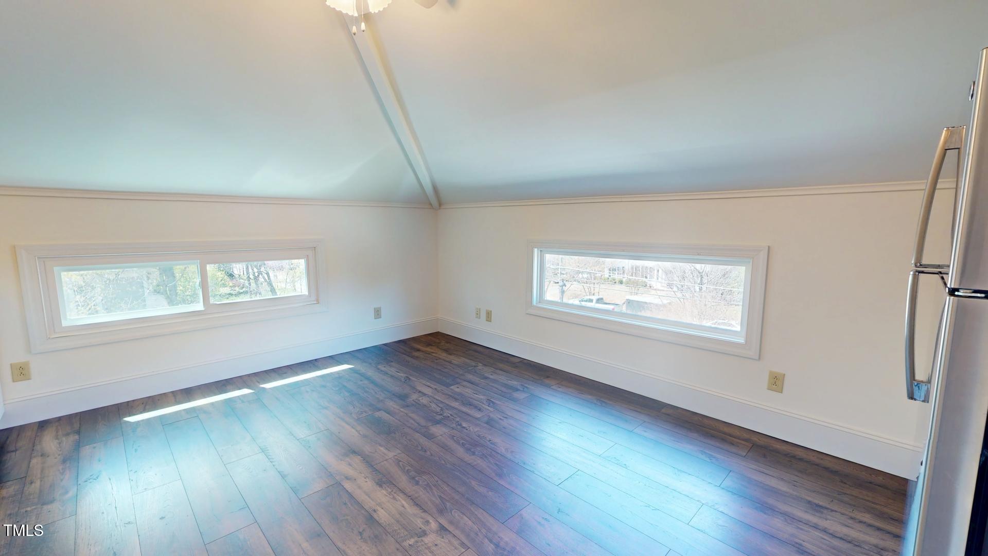 238 North Main Street Wake Forest, NC 27587 - Photo 79 of 100 an empty room with wooden floor and windows