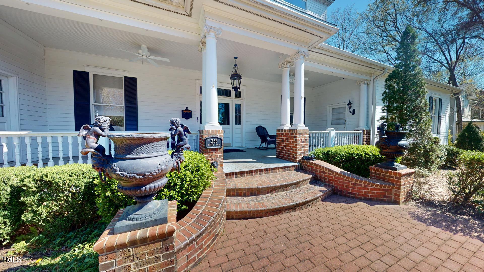238 North Main Street Wake Forest, NC 27587 - Photo 90 of 100 a view of an house with backyard and outdoor seating