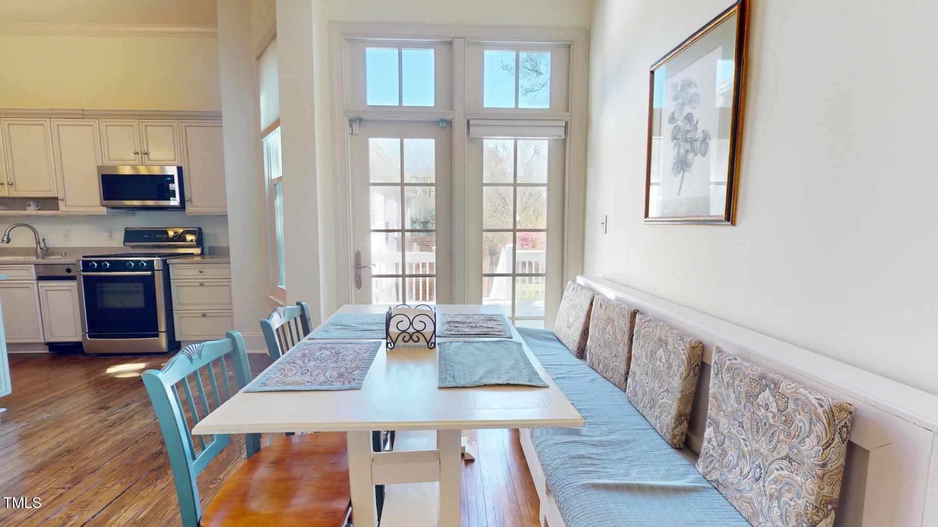 238 North Main Street Wake Forest, NC 27587 - Photo 10 of 100 a view of a dining room with furniture window and wooden floor