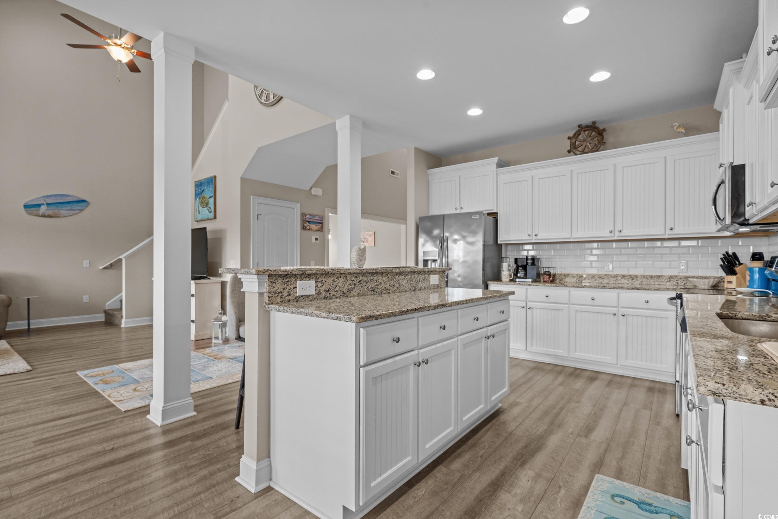 3624 Edwards Road Aynor, SC 29511 - Photo 40 of 40 Kitchen with white cabinetry, decorative backsplash, open floor plan, and recessed lighting