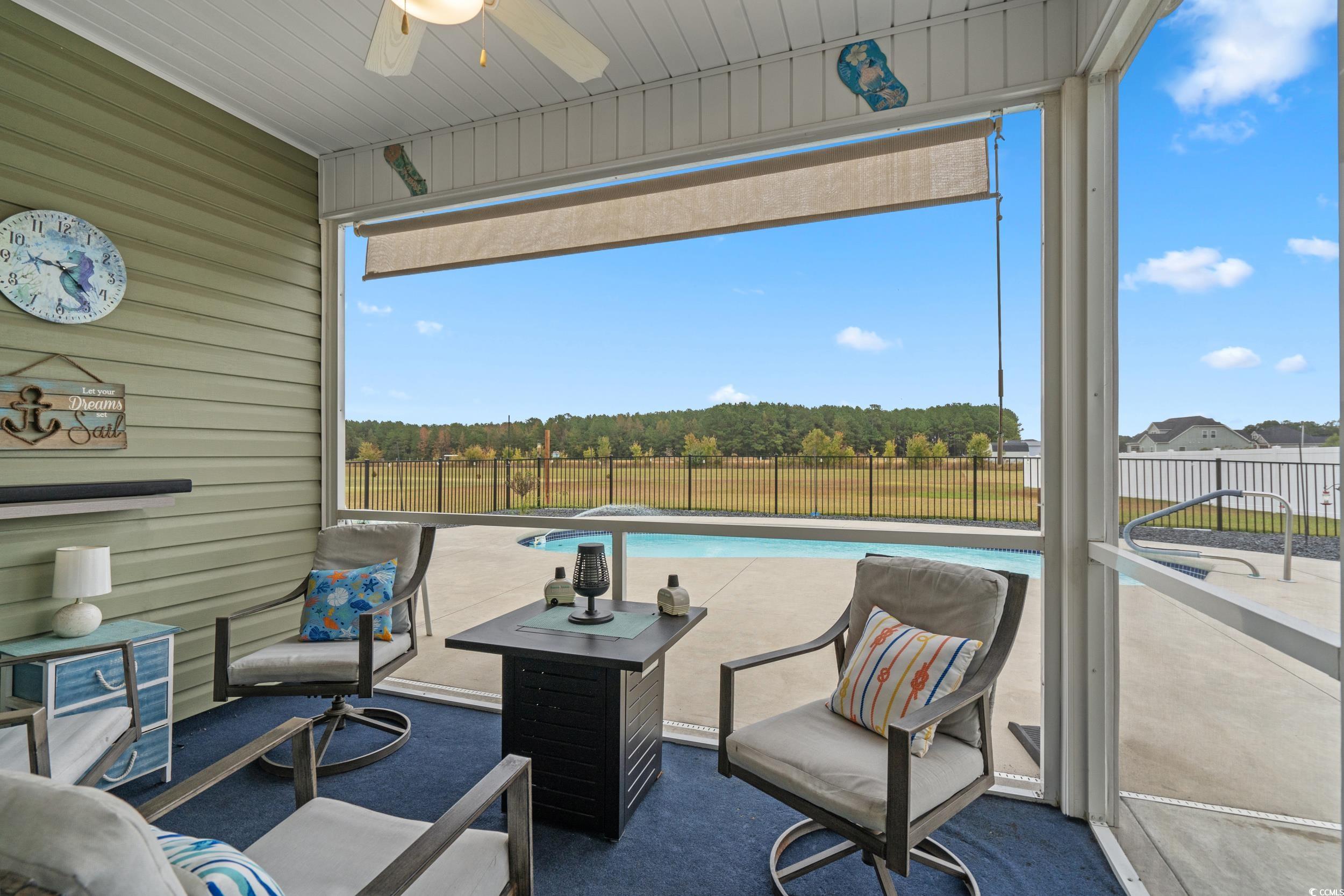 3624 Edwards Road Aynor, SC 29511 - Photo 15 of 40 Sunroom with wood walls and carpet floors