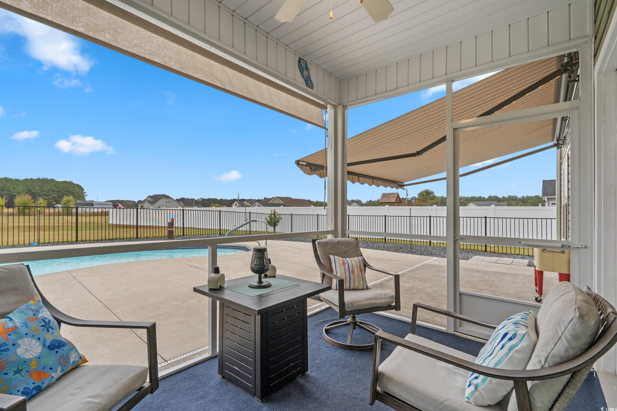 3624 Edwards Road Aynor, SC 29511 - Photo 16 of 40 Fenced backyard with a patio area and a ceiling fan