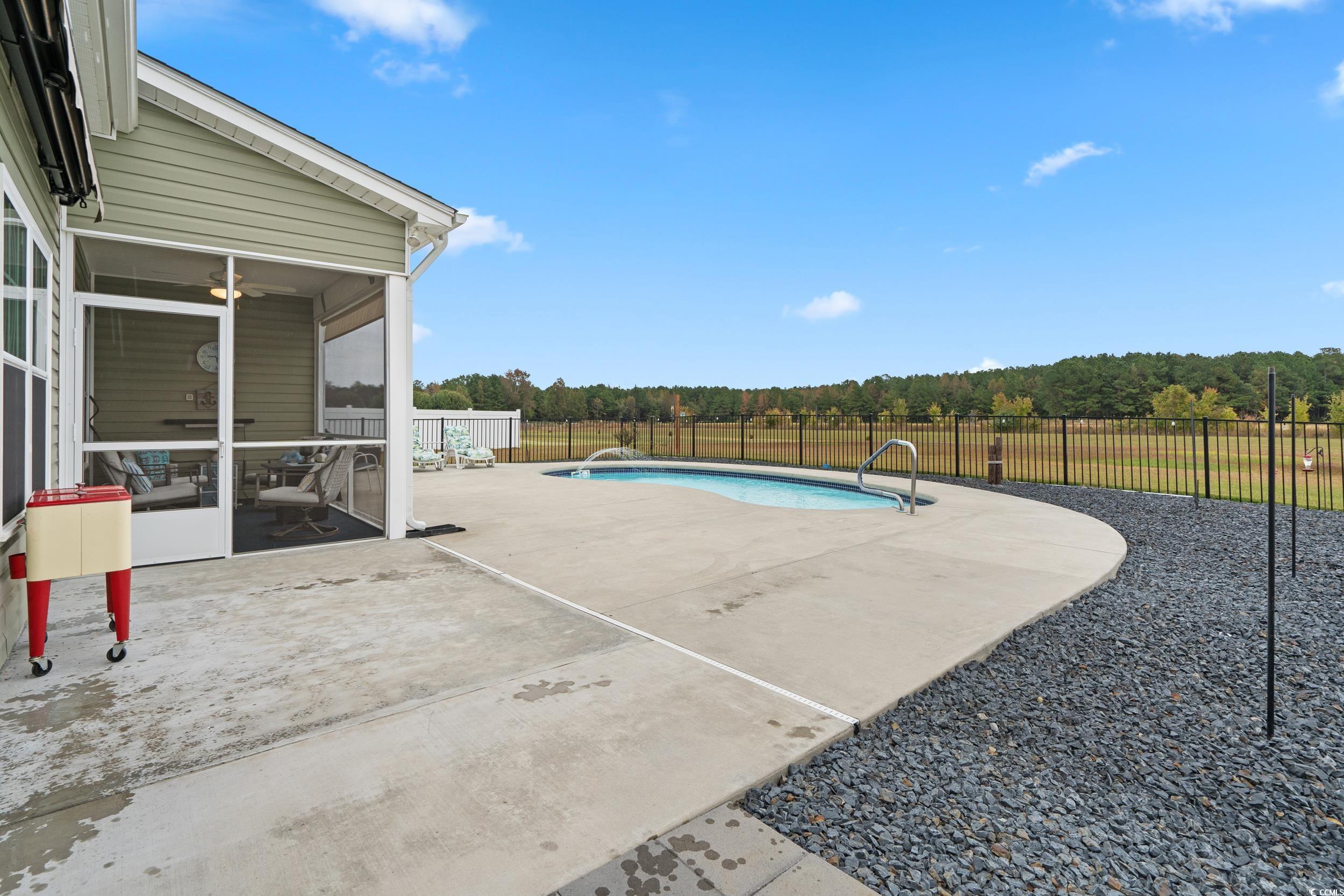 3624 Edwards Road Aynor, SC 29511 - Photo 18 of 40 View of swimming pool featuring a sunroom, a patio area, and a fenced backyard