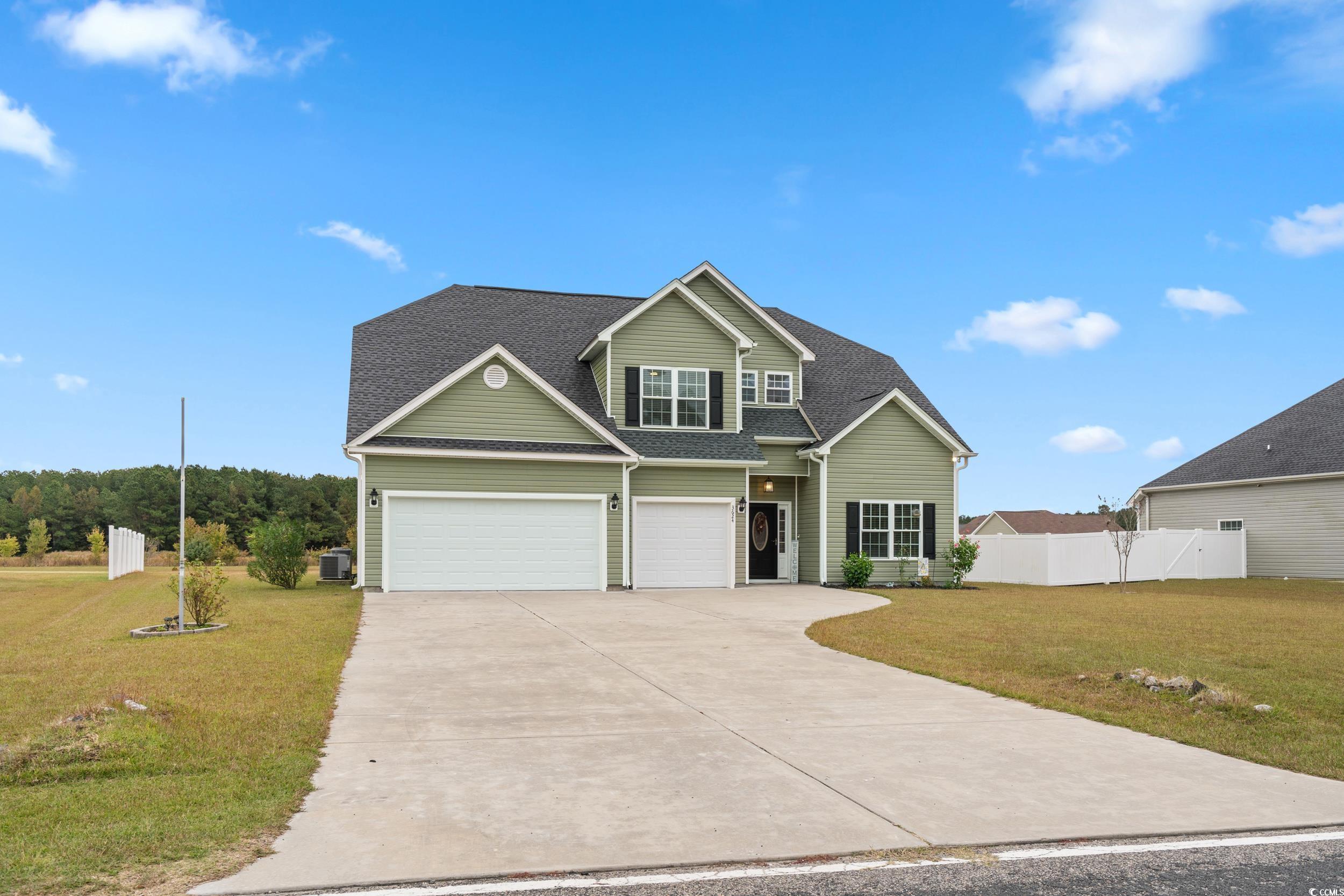 3624 Edwards Road Aynor, SC 29511 - Photo 34 of 40 Traditional-style home featuring concrete driveway, a shingled roof, and an attached garage