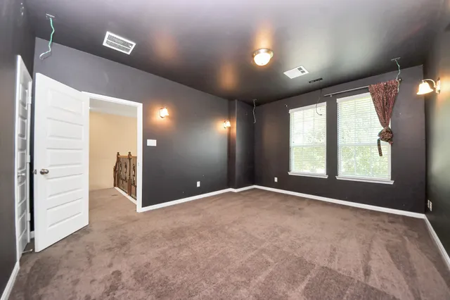 a view of an empty room and window