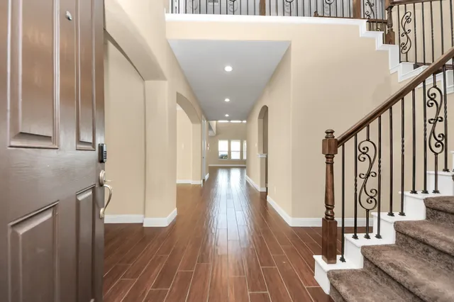 a view of gallery with wooden floor