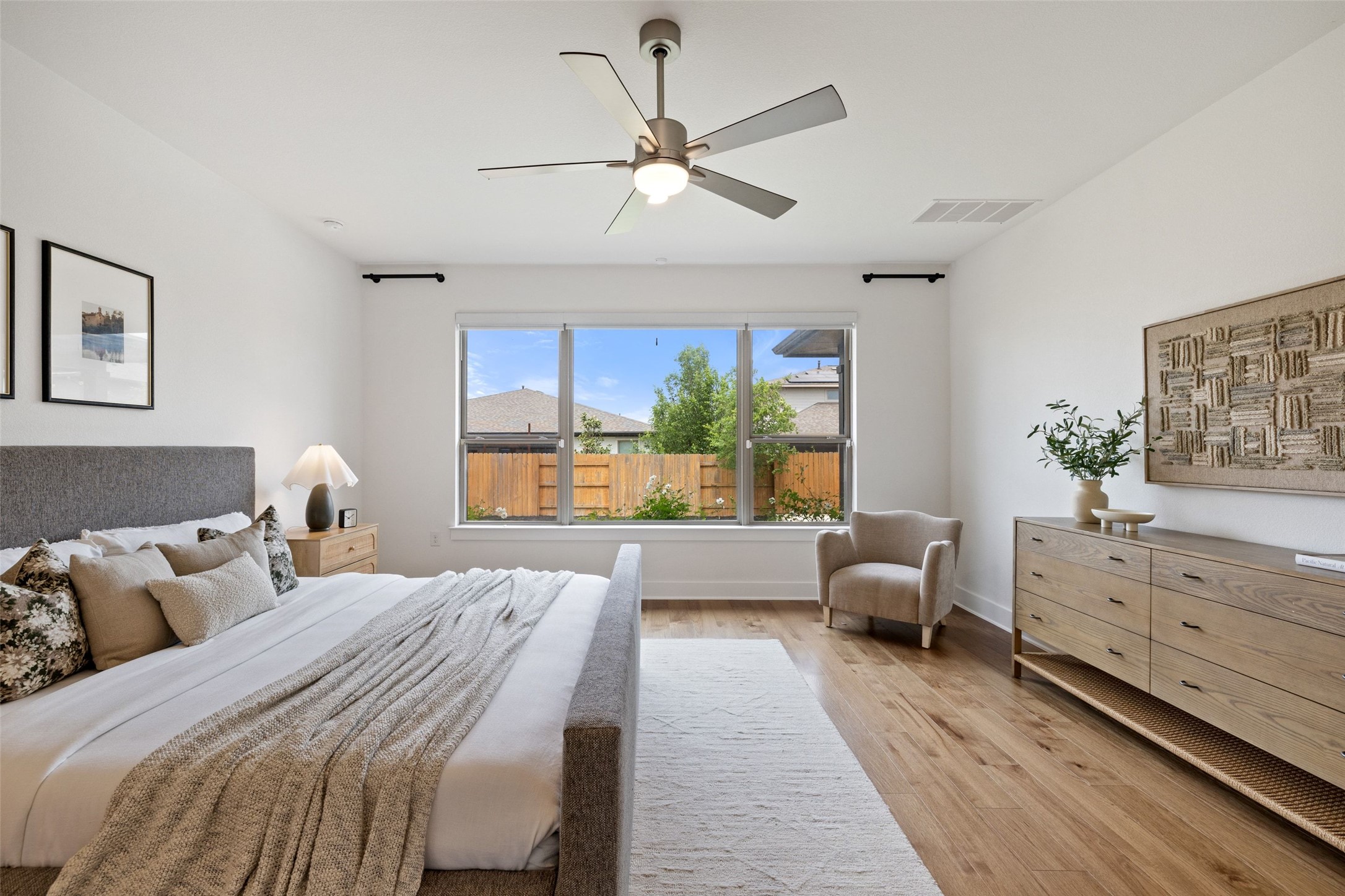 7908 Yokohama Terrace Austin, TX 78744 - Photo 22 of 40 a bed room with a bed and a large window