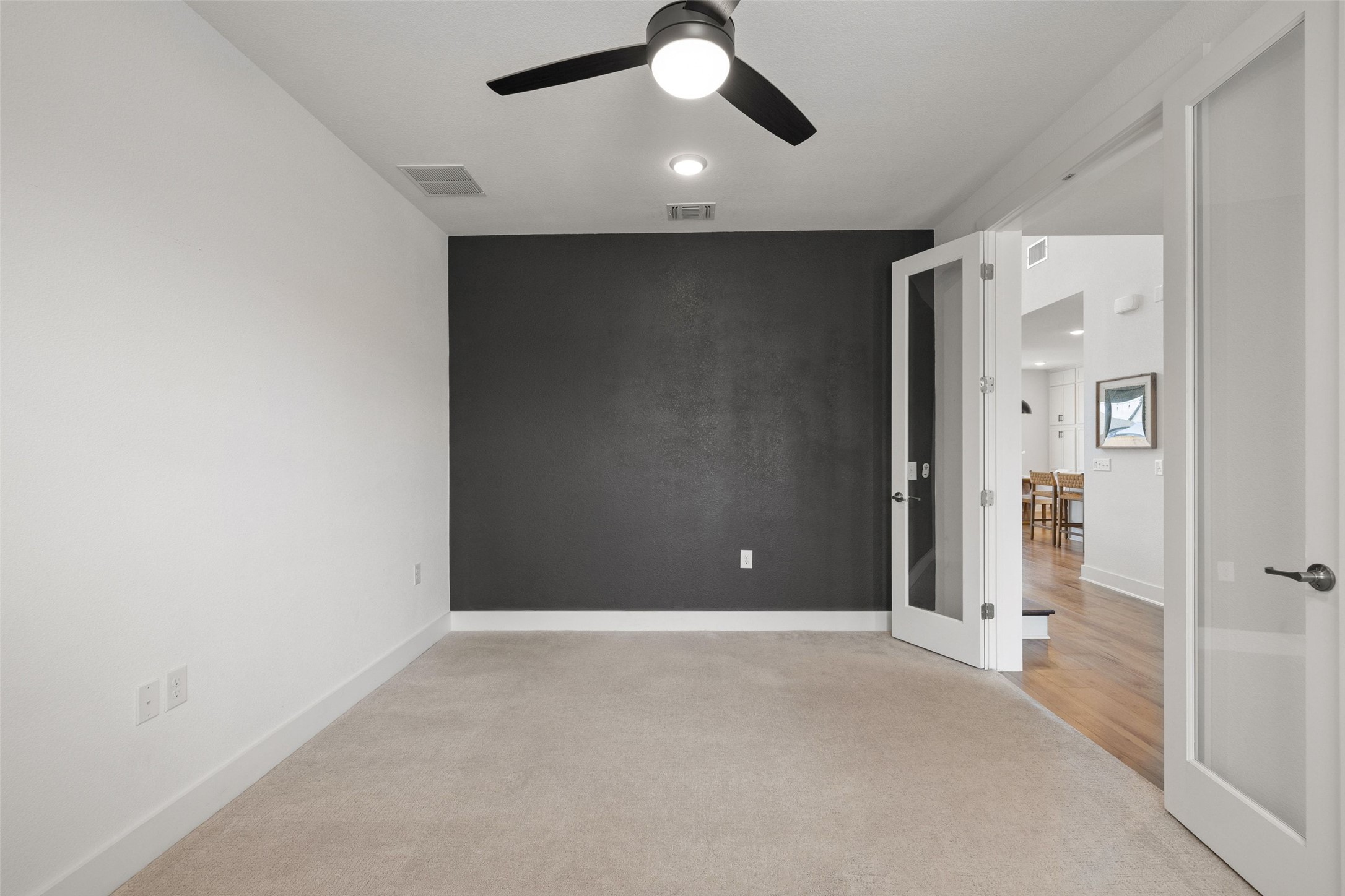 7908 Yokohama Terrace Austin, TX 78744 - Photo 27 of 40 an empty room with closet and a chandelier fan