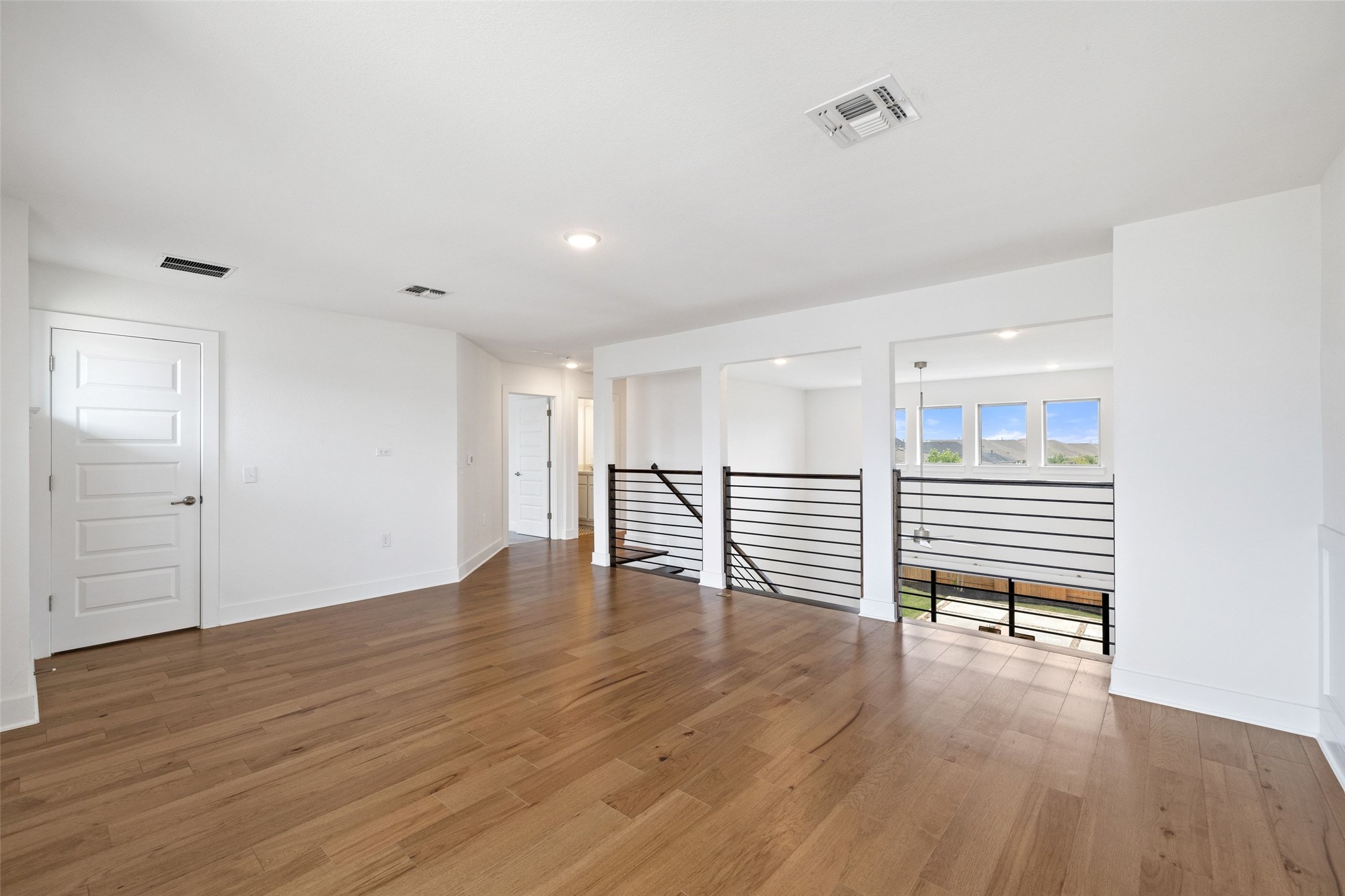 7908 Yokohama Terrace Austin, TX 78744 - Photo 33 of 40 a view of empty room with wooden floor